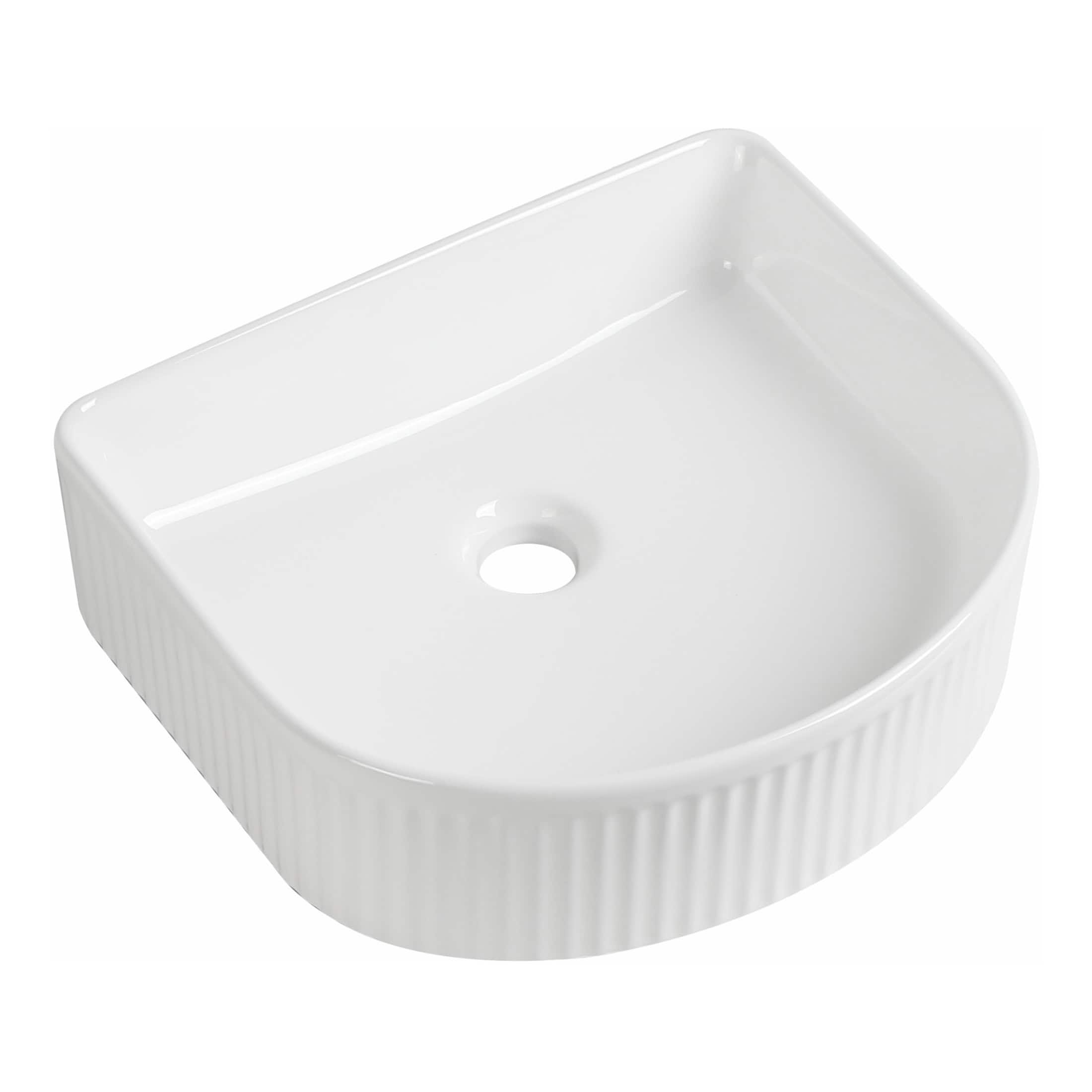 Sleek white ceramic bathroom sink with ridged sides, modern design, and central drain hole, ideal for contemporary bathroom renovations and spaces needing stylish, functional fixtures.
