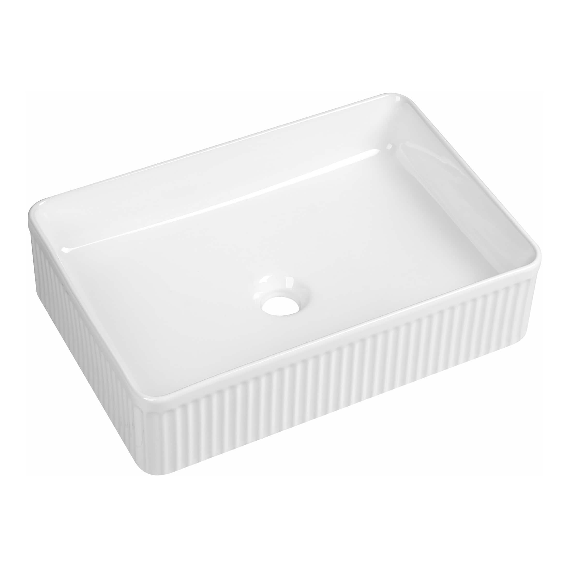Polished white ceramic bathroom sink with fluted sides and central drain hole, ideal for modern or vintage bathroom designs.