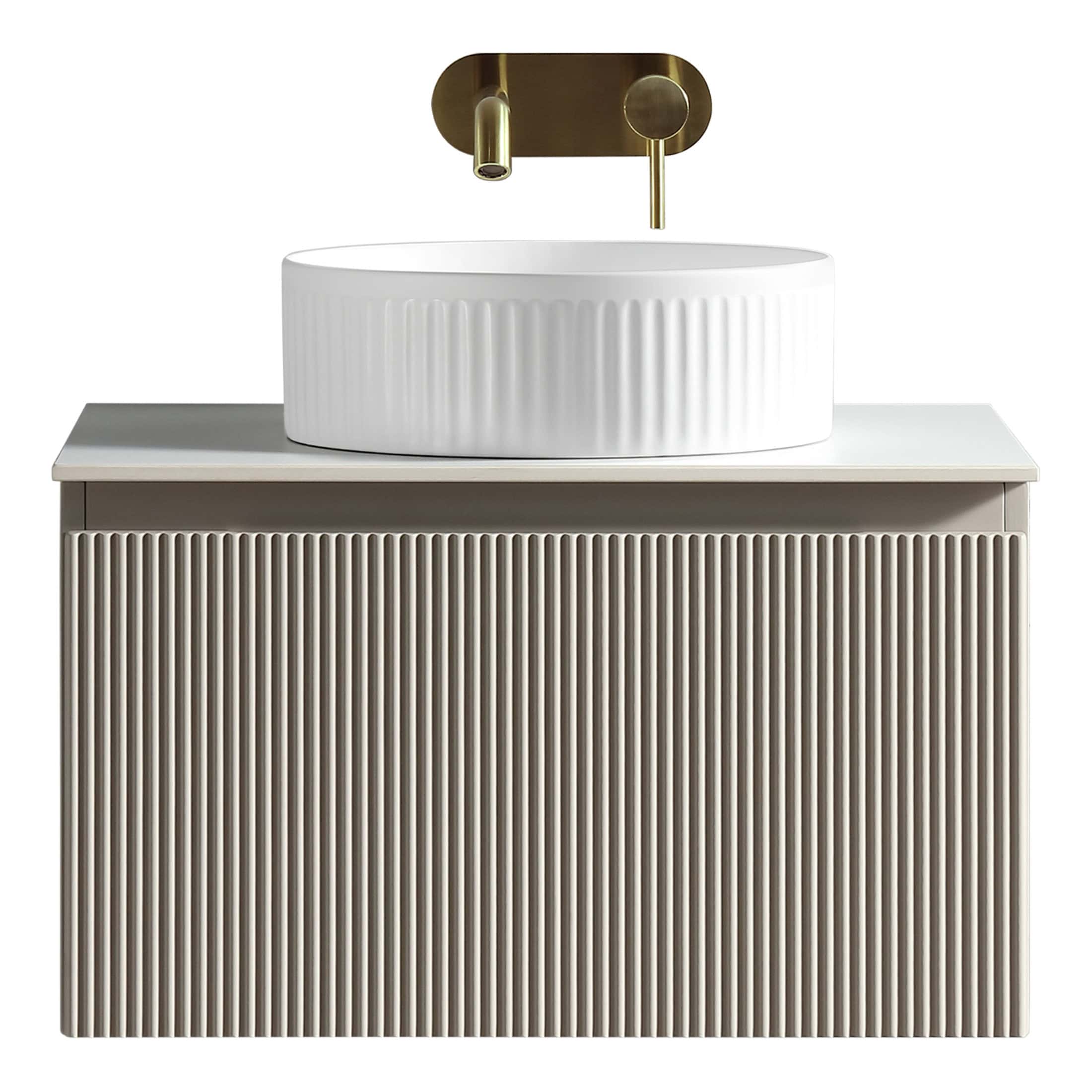 Luxury bathroom vanity unit with a ribbed textured finish and a modern white vessel sink, featuring a sleek gold wall-mounted tap for a stylish bathroom upgrade.