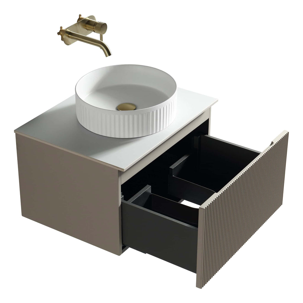 Modern bathroom vanity with a stylish vessel sink and sleek gold fixtures, ideal for contemporary bathroom designs.
