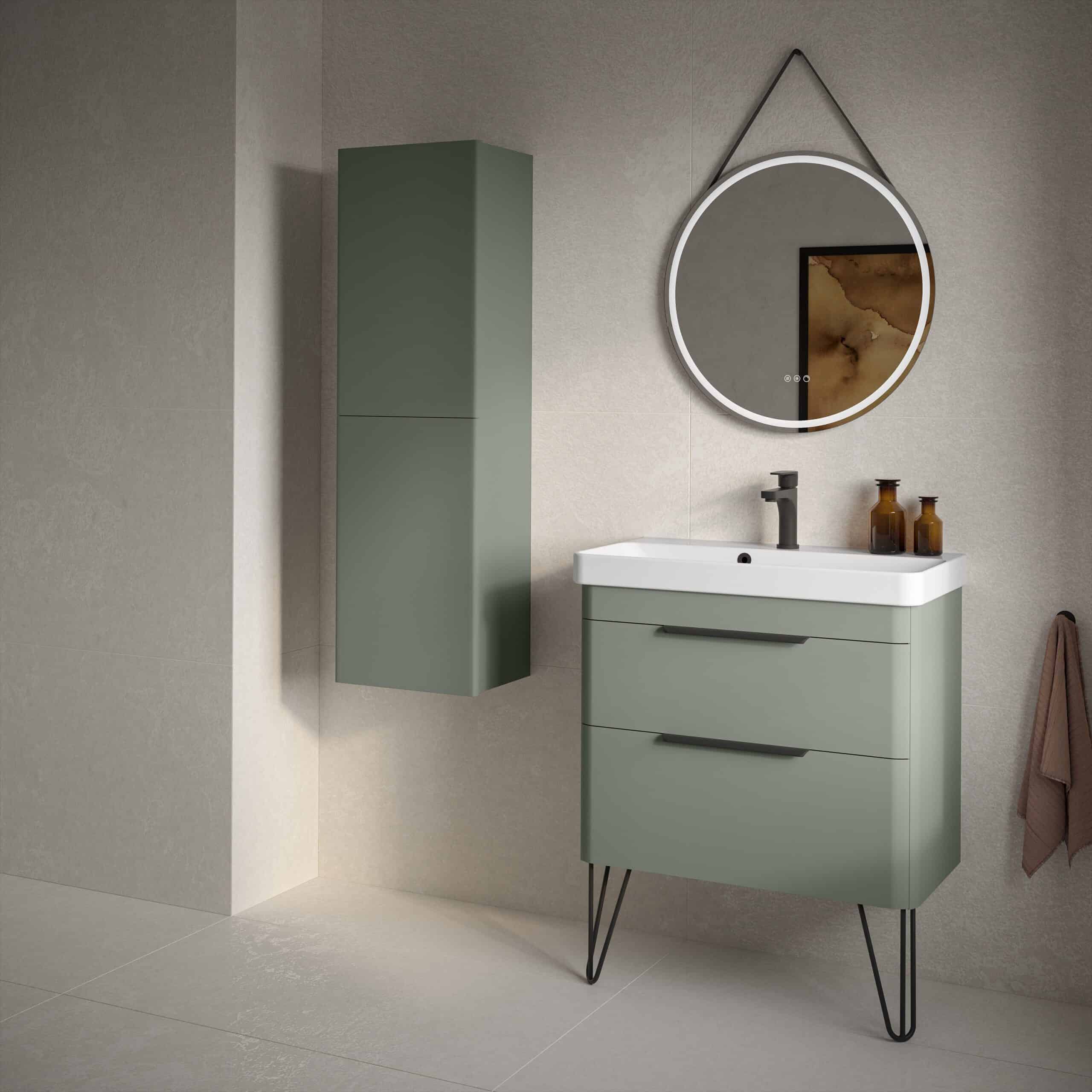 Sleek modern bathroom vanity set with a matching wall-mounted cabinet in sage green, featuring minimalist design, black hardware, and a round mirror for contemporary bathroom decor.