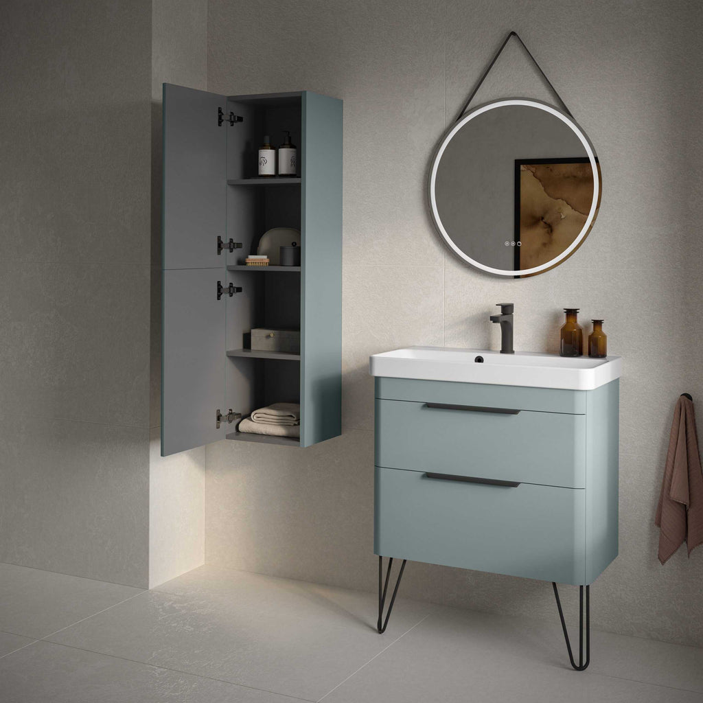 Sleek modern bathroom vanity with a matching wall-mounted storage cabinet in soft blue, featuring minimalist design, black fixtures, and stylish accessories for a contemporary bathroom look.