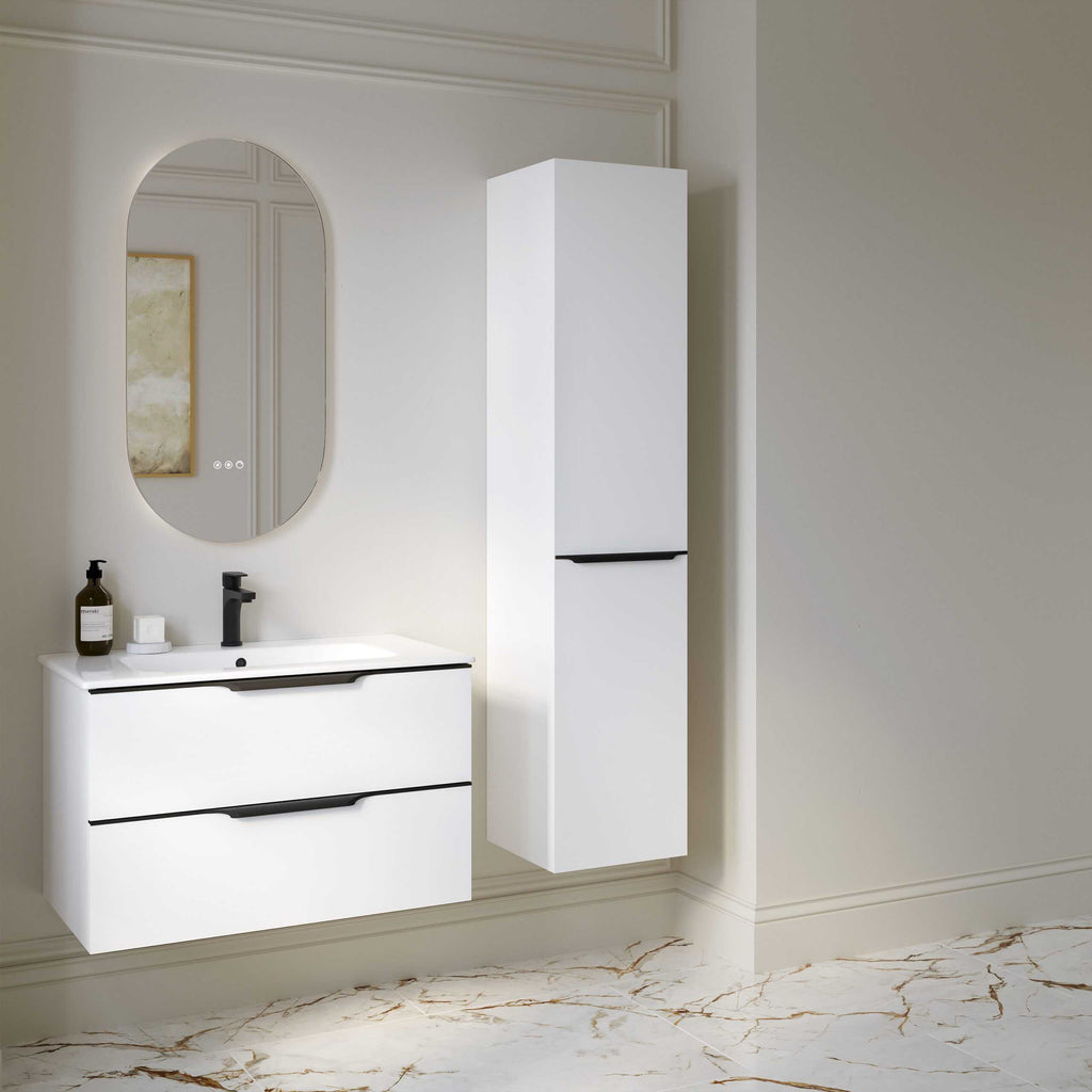 Sleek modern white bathroom vanity unit with a black handle, wall-mounted mirror, and matching tall storage cabinet, featuring stylish minimalistic design for contemporary bathrooms.