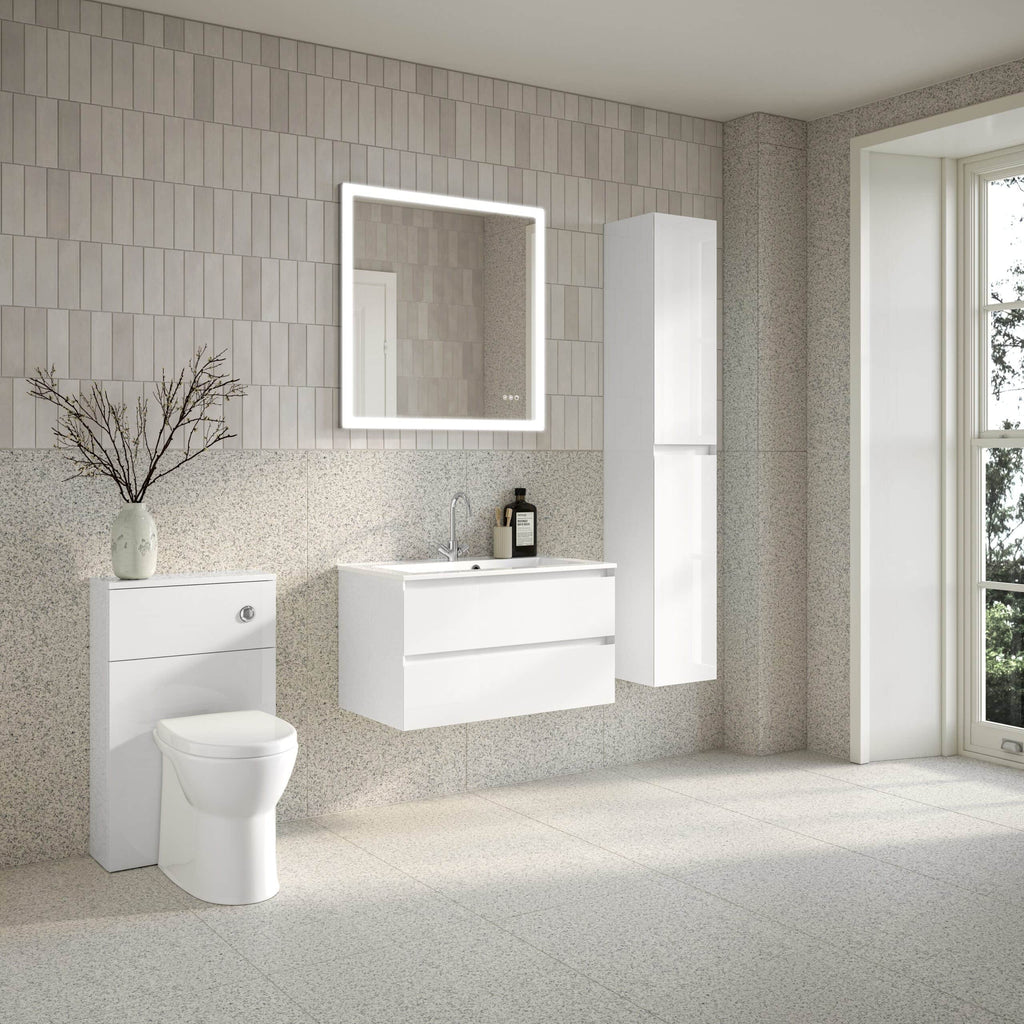 Modern minimalist white bathroom with floating vanity, illuminated mirror, and smart storage cabinet, featuring neutral tiled walls and large window for natural light. Perfect for contemporary bathroom design.
