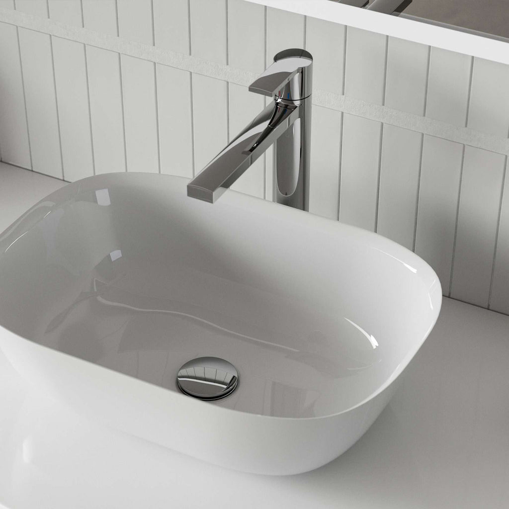 Sleek modern bathroom sink with chrome tap, close-up view showcasing stylish design and clean white finish, ideal for contemporary bathroom settings.