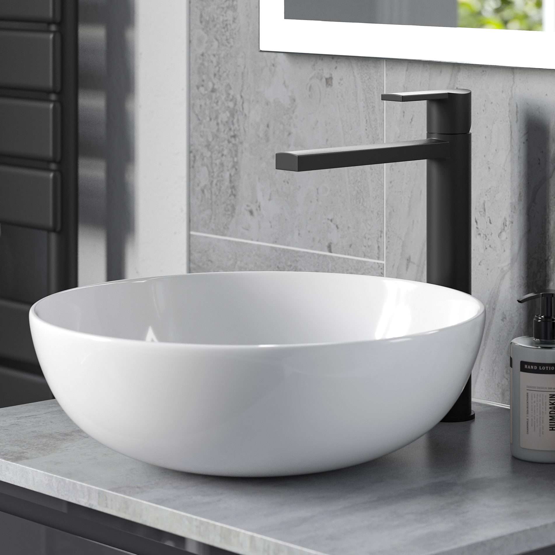 Sleek modern bathroom basin with matte black faucet and grey marble countertop, exemplifying contemporary bathroom design and luxury fixtures.