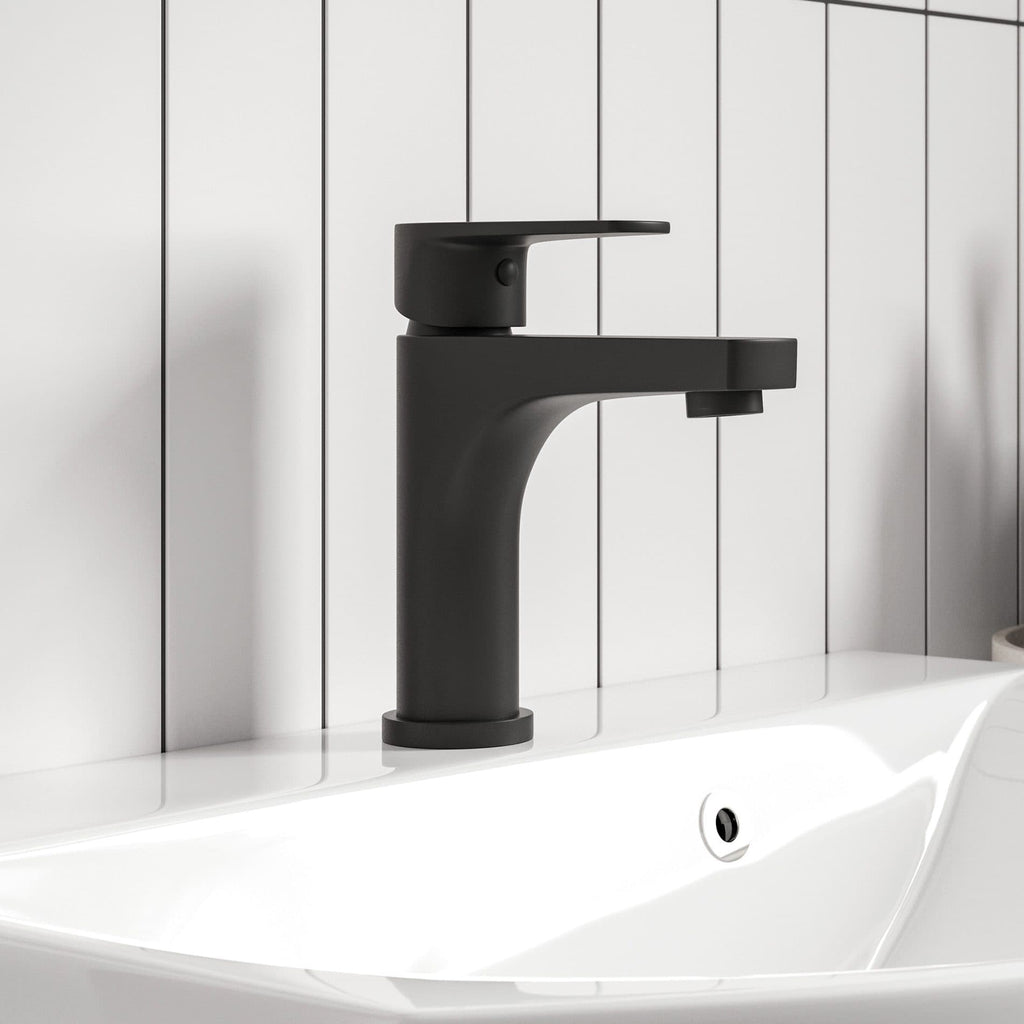 Sleek black bathroom sink mixer tap on white basin with vertical white panel background, modern bathroom fixtures, stylish black tap, contemporary bathroom design, minimalistic style, high-quality bathroom accessories.
