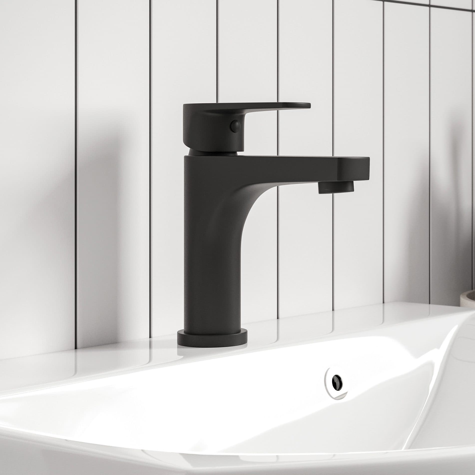 Sleek black bathroom sink mixer tap on white basin with vertical white panel background, modern bathroom fixtures, stylish black tap, contemporary bathroom design, minimalistic style, high-quality bathroom accessories.
