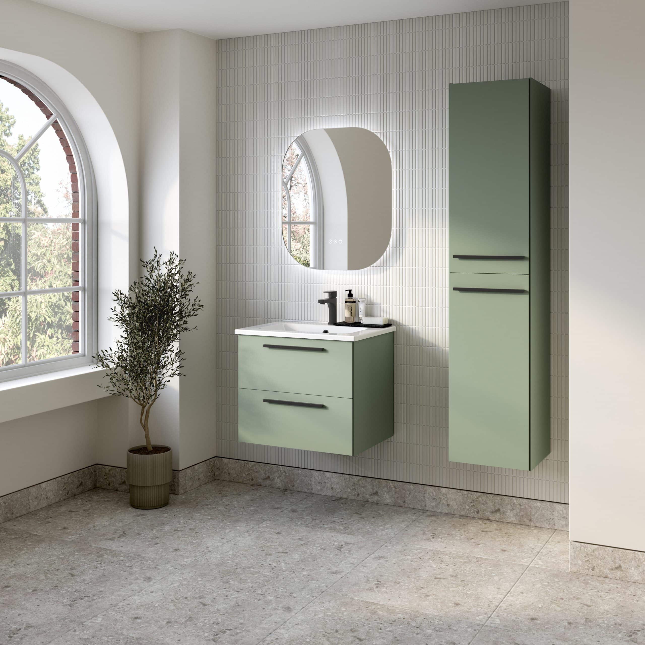 Modern bathroom vanity with green cabinetry, wall-mounted mirror with LED lighting, and natural light from large arched window, showcasing premium bathroom furniture and design.
