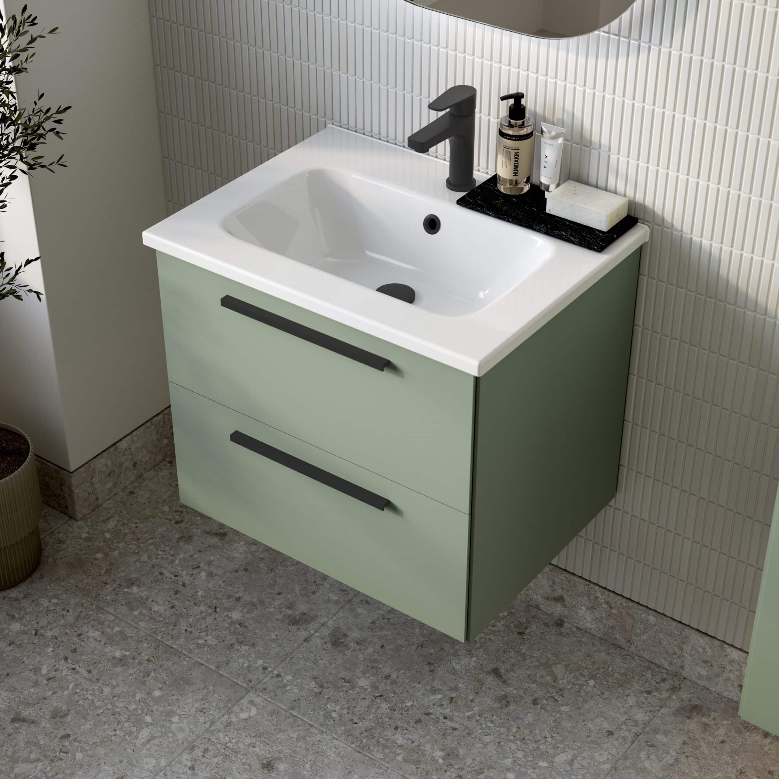 Modern bathroom vanity with a sleek white sink, matte black handles, and minimalist design for stylish bathroom storage solutions.