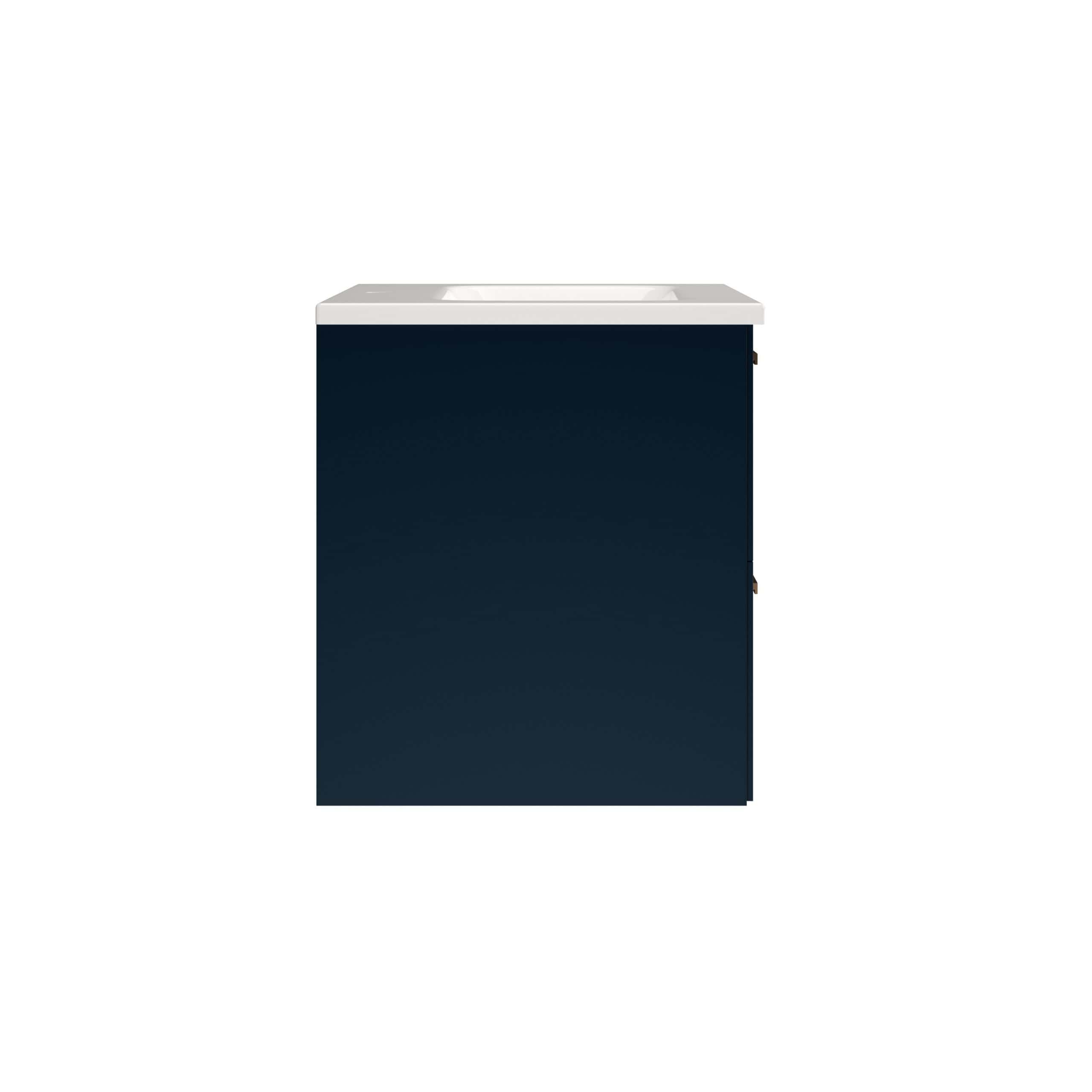 Compact bathroom vanity with dark navy cabinet and integrated white sink, ideal for modern small bathroom designs. Perfect for stylish bathroom storage and contemporary decor.