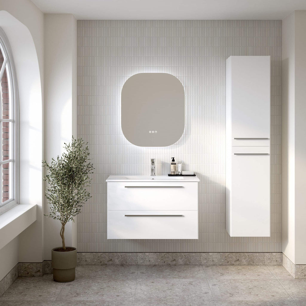 Sleek white bathroom vanity with drawer storage, modern mirror with backlighting, and tall storage cabinet in minimalist bathroom interior, natural light from arched window, neutral colour palette, contemporary design, Bubly Bathrooms.