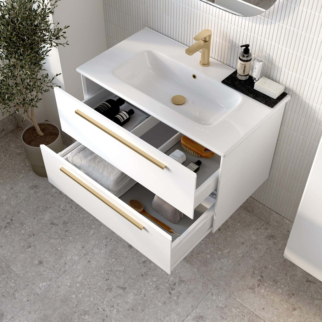 Sleek modern bathroom vanity with white finish, gold handles, built-in sink, and organised drawers for toiletries and accessories, perfect for stylish and functional bathroom storage.