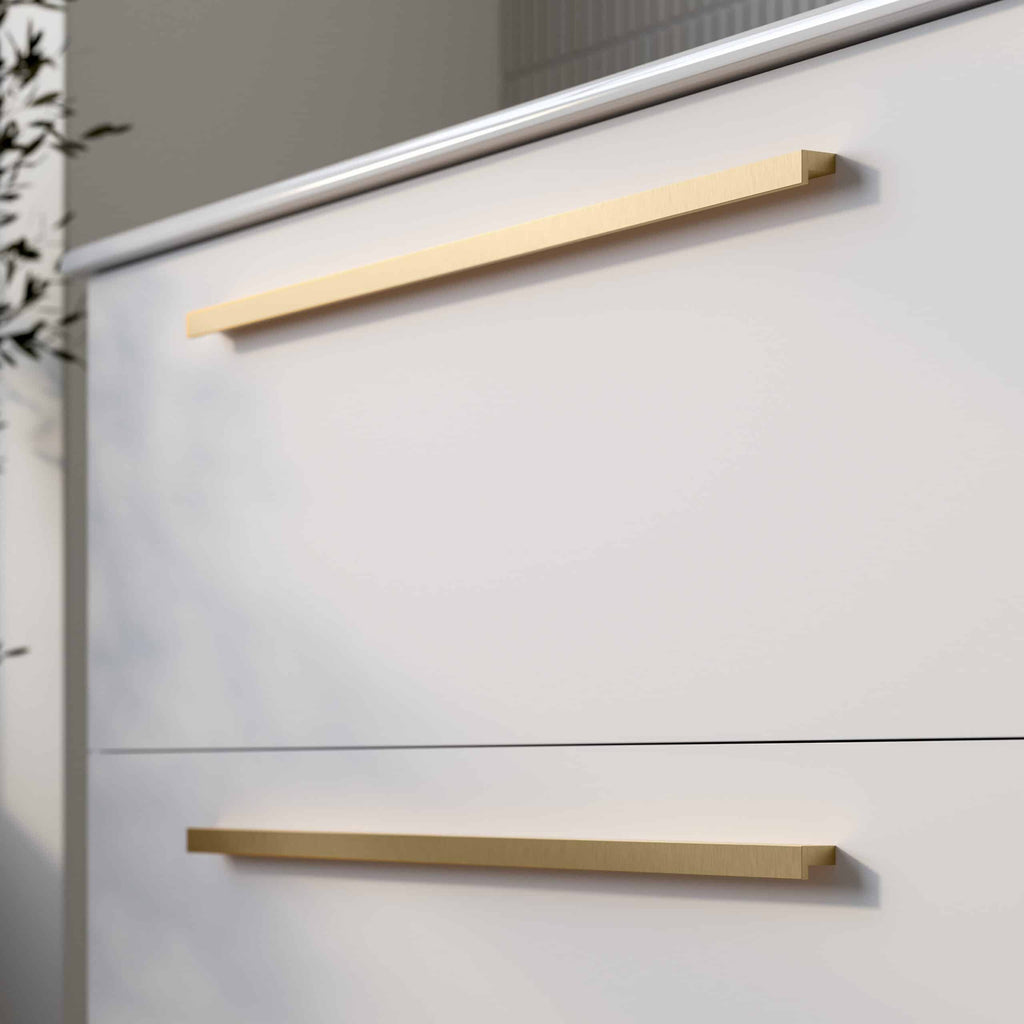 Sleek modern bathroom drawer handles with a minimalist design in a luxury bathroom setting. Perfect for contemporary bathroom furniture and cabinetry.