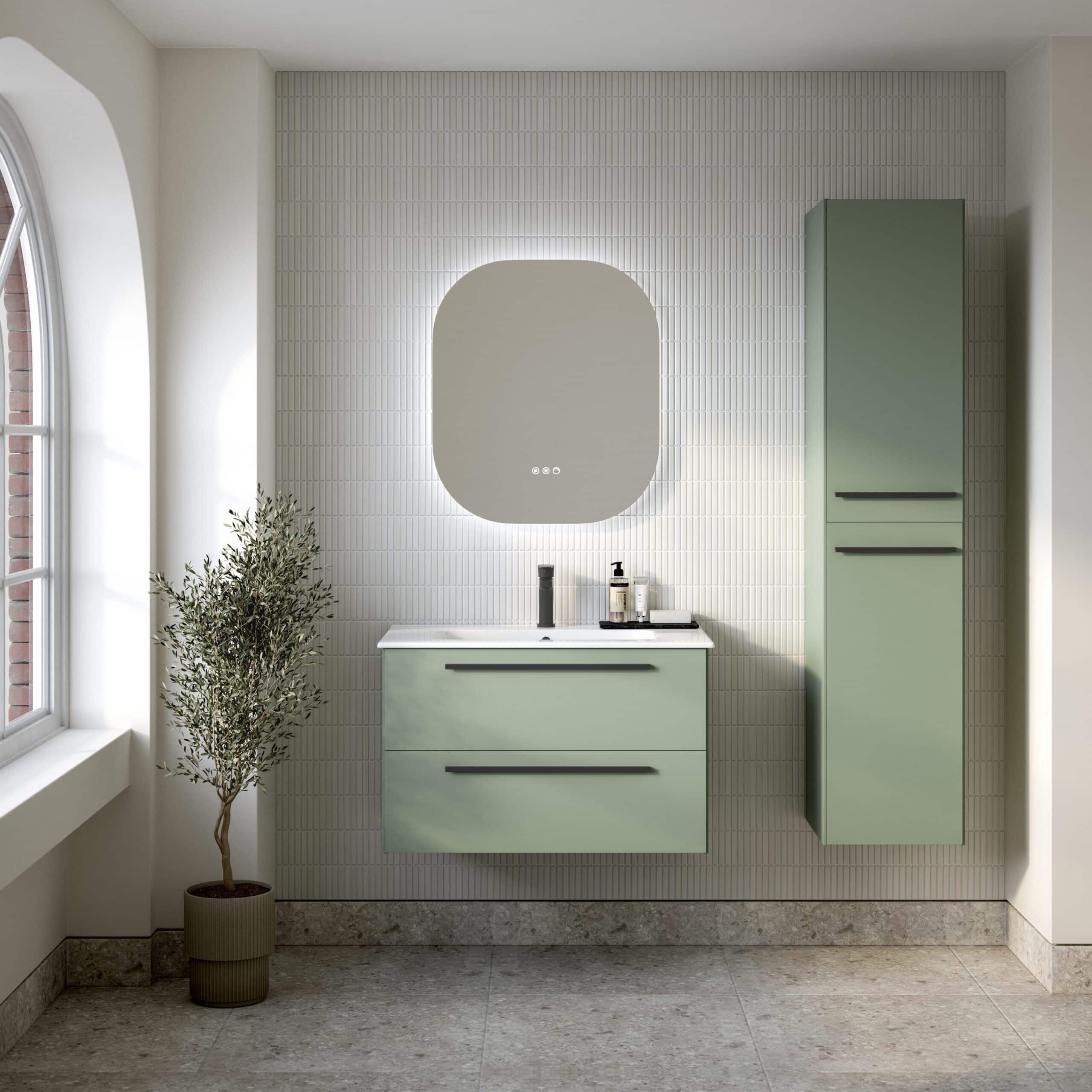 Sleek green bathroom vanity with matching tall cabinet, modern wall mirror, natural light, minimalistic design, and decorative plant, showcasing contemporary bathroom furniture by Bubly Bathrooms.
