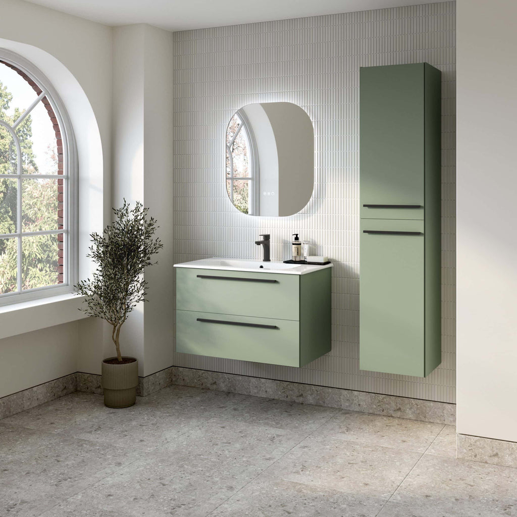 Stylish green bathroom vanity set with matching tall storage cabinet, modern black fixtures, and a backlit mirror, creating a sleek, contemporary look in a bright, minimalist bathroom.