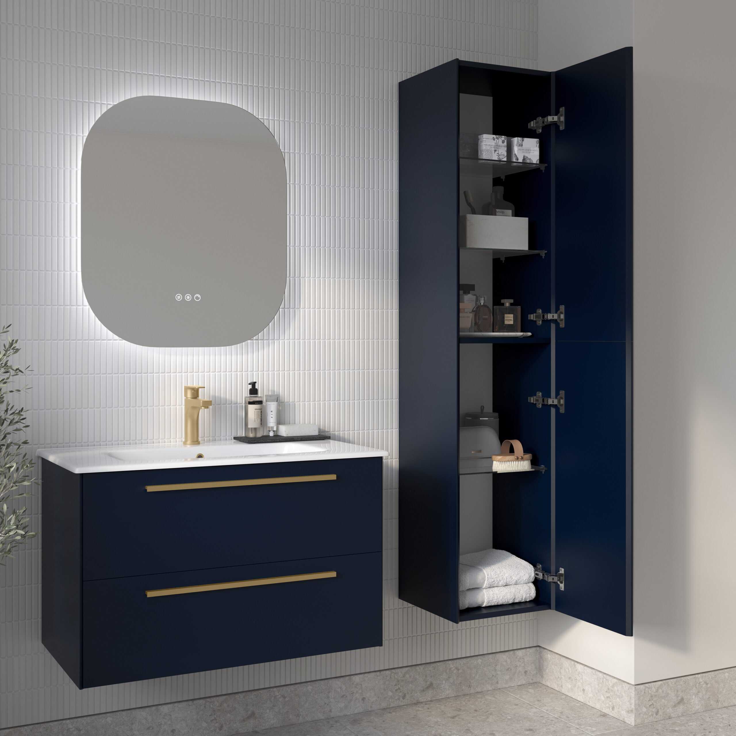 Stylish navy blue bathroom vanity with gold handles, modern white countertop, and wall-mounted mirror, complemented by a matching storage cabinet for a sleek, organised bathroom space.