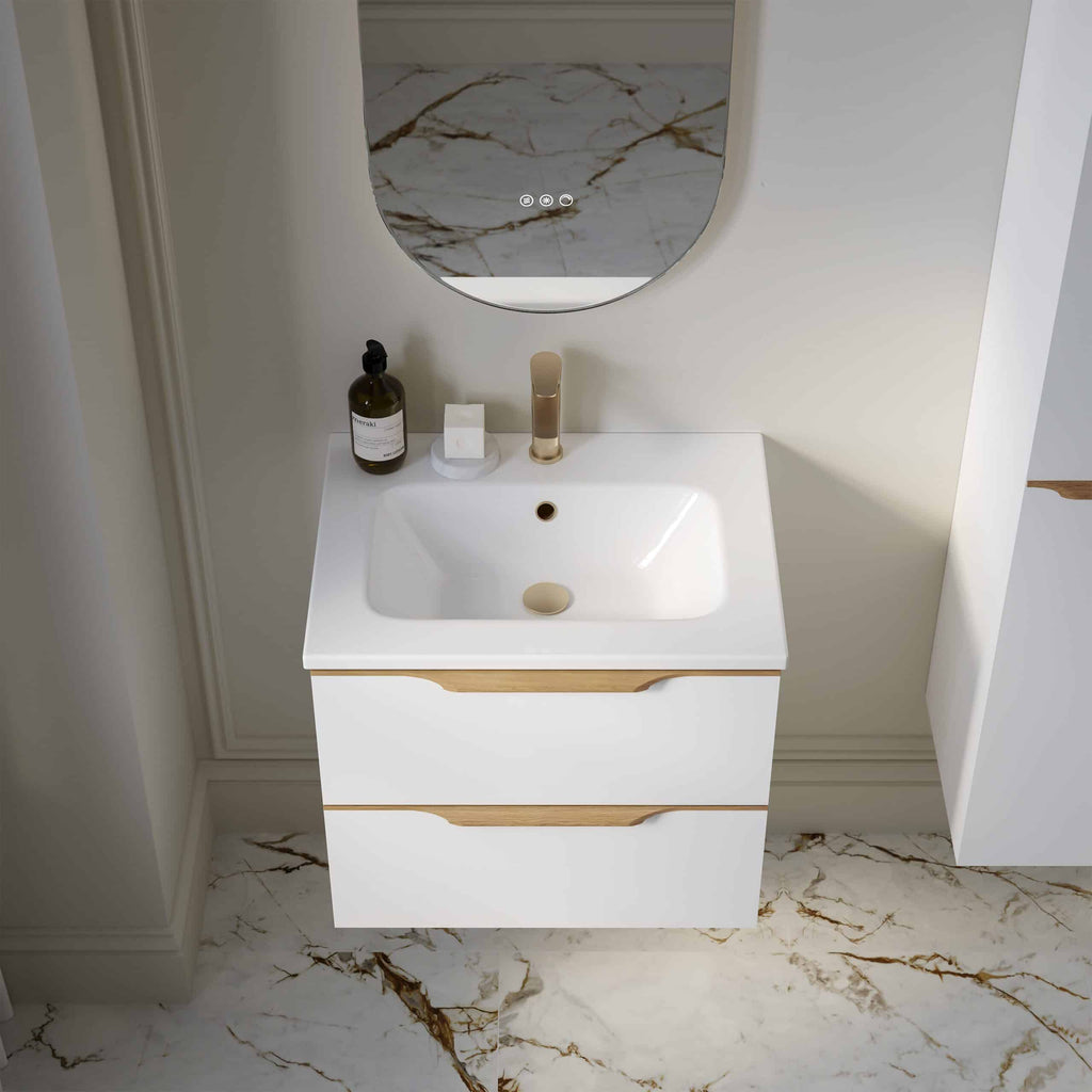 Modern white bathroom vanity with sleek wooden accents and marble flooring, featuring contemporary fixtures and minimalistic design for elegant bathroom renovation.