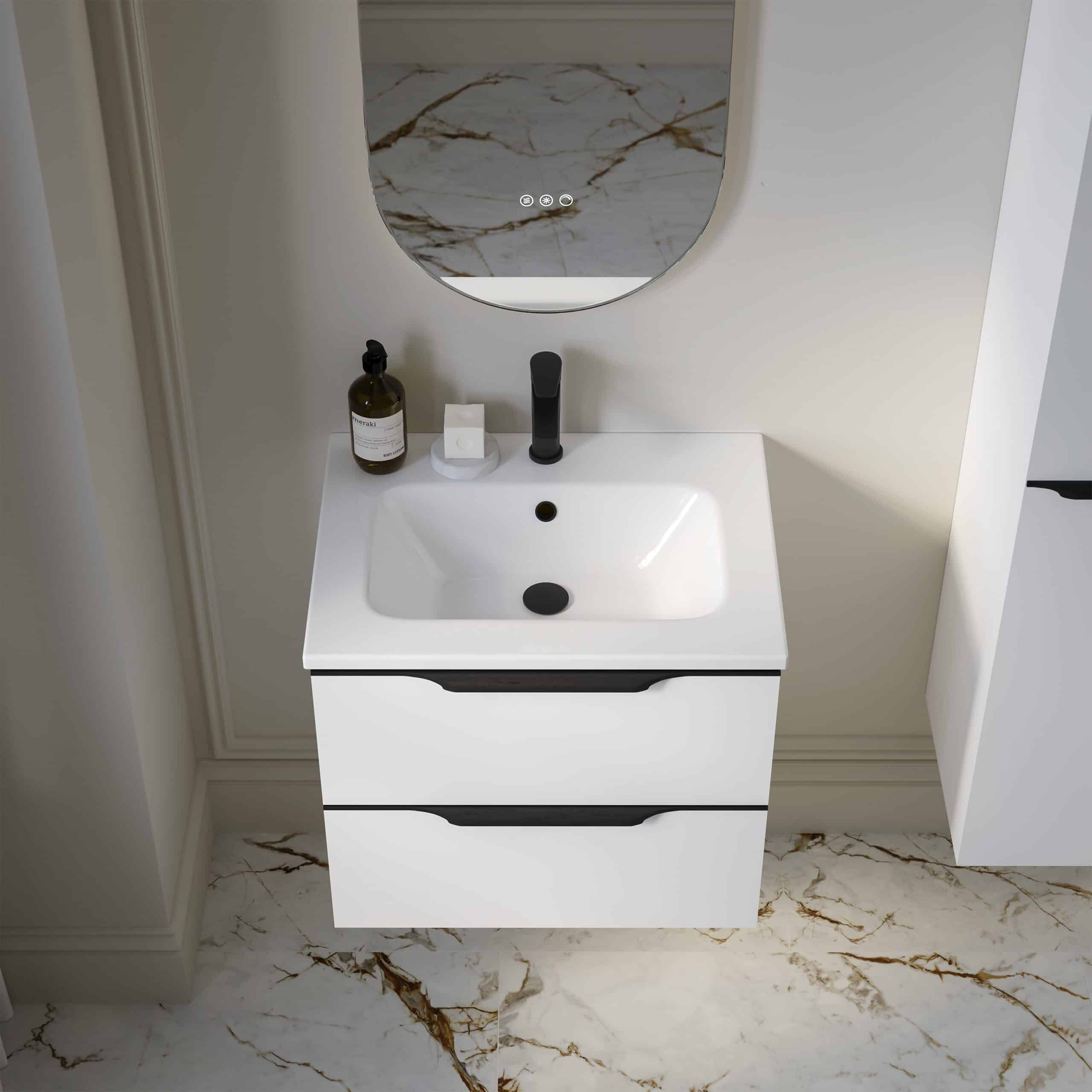 Modern white bathroom vanity with sleek black handles, integrated sink, and wall-mounted mirror featuring marble accents, ideal for contemporary bathroom bathroom bathroom decor and plumbing solutions.