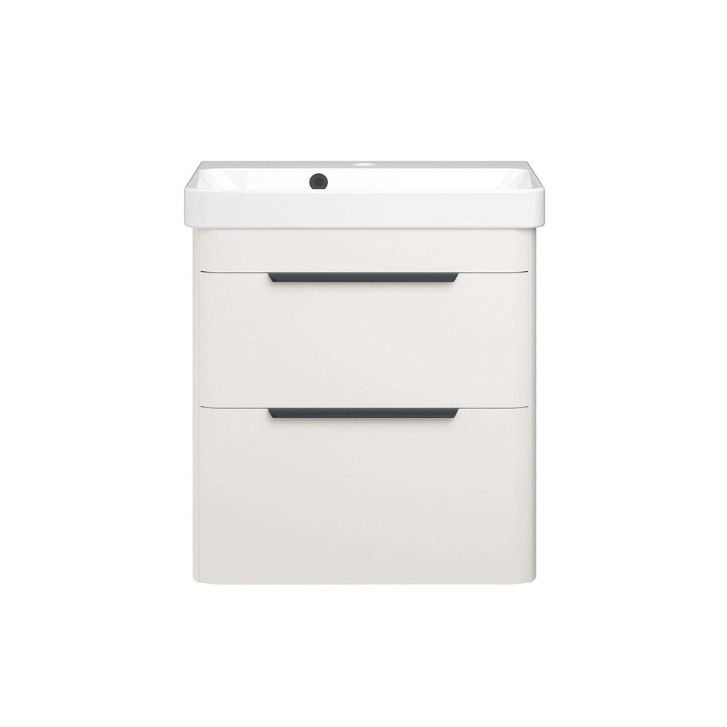 Sleek white bathroom vanity with integrated washbasin and modern black handle accents, ideal for contemporary bathroom designs and maximising space. Perfect for stylish bathroom furniture solutions.