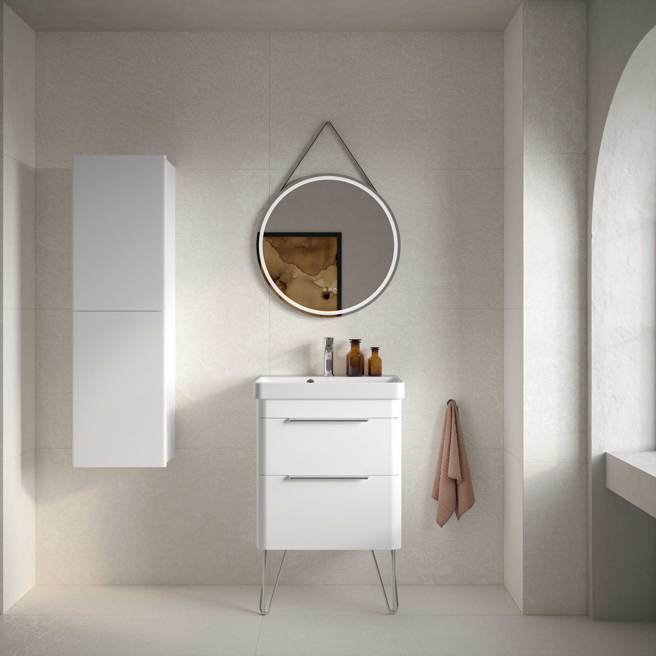 Sleek white bathroom vanity with modern drawer handles, wall-mounted cabinet, and circular mirror with LED lighting in a contemporary bathroom setting.
