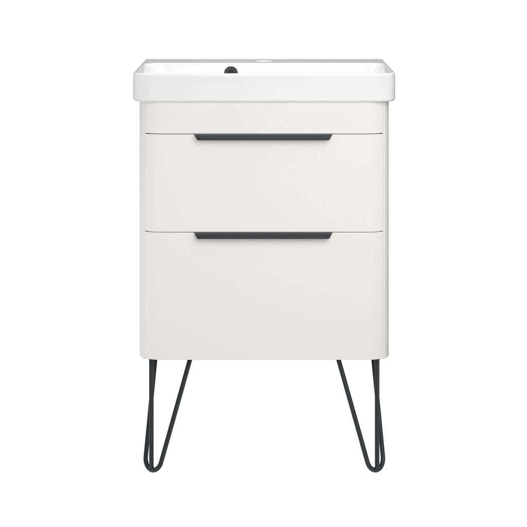 Modern white bathroom vanity with sleek black handles and angled black metal legs, designed for contemporary bathroom storage and style.