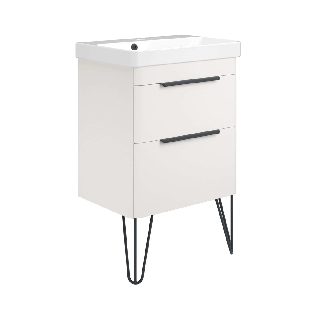 Modern white bathroom vanity with black handles and hairpin legs, ideal for contemporary bathroom design. Features storage drawers and a compact basin for efficient space utilisation.