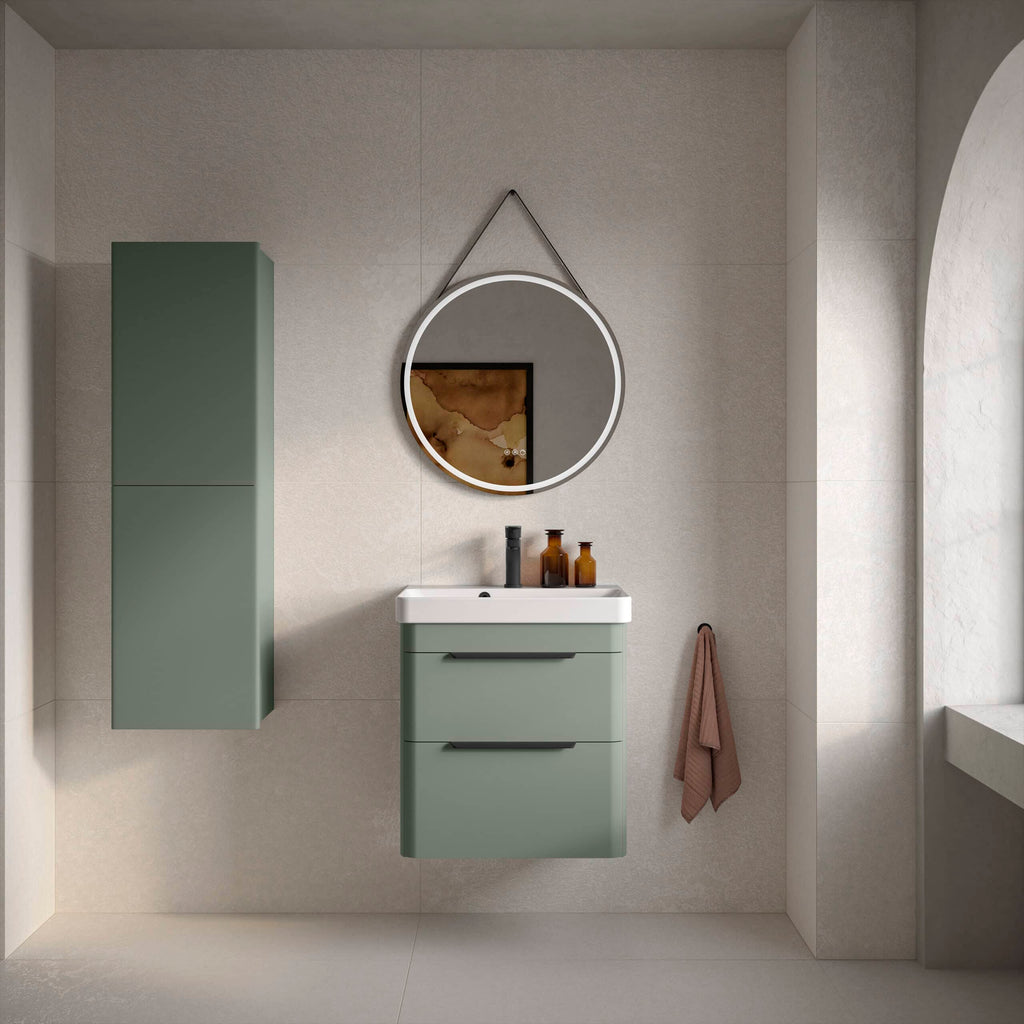 Sleek green bathroom vanity unit with a matching wall cabinet, modern round illuminated mirror, and minimalist decor in a contemporary bathroom setting. Perfect for stylish bathroom storage and design.