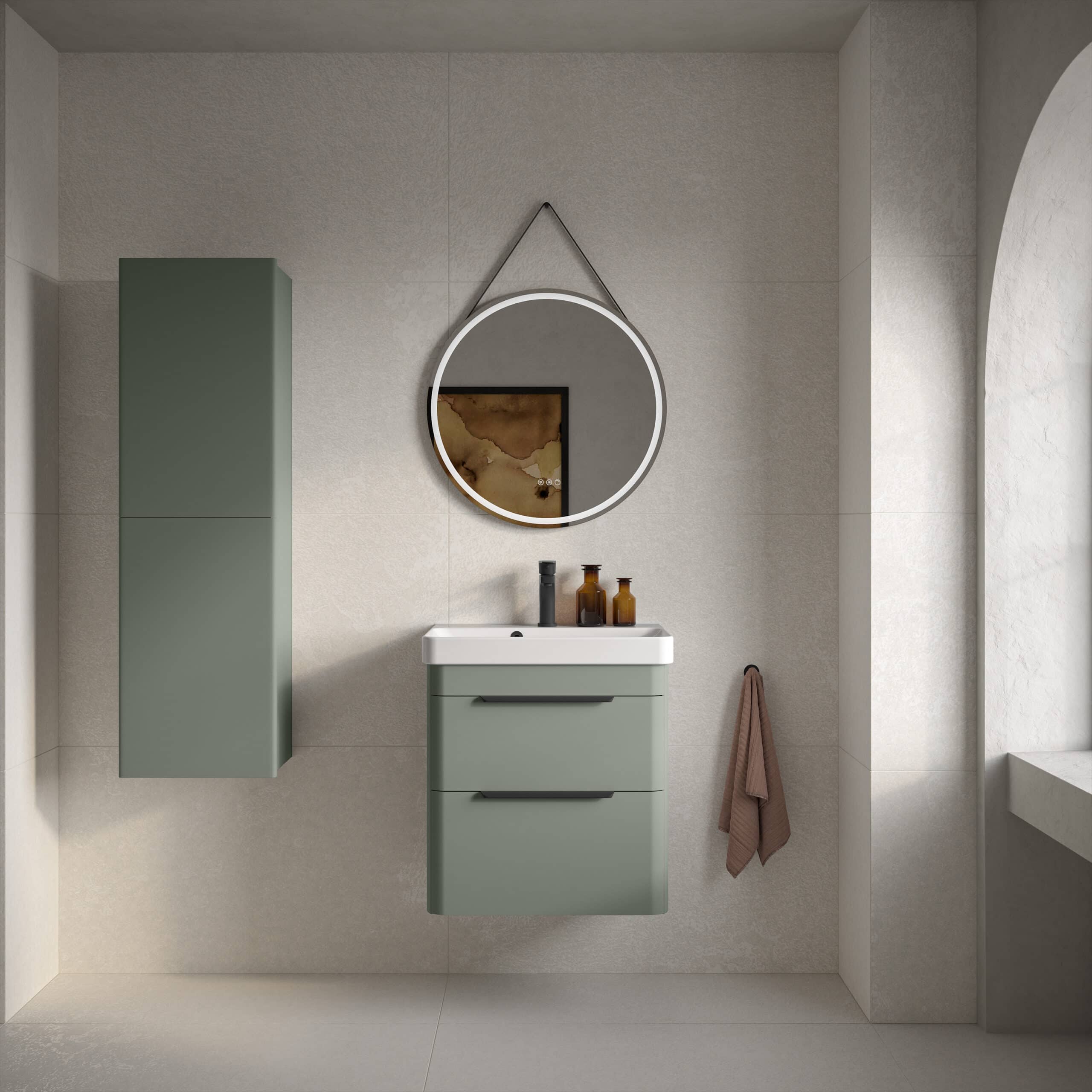 Sleek green bathroom vanity unit with a matching wall cabinet, modern round illuminated mirror, and minimalist decor in a contemporary bathroom setting. Perfect for stylish bathroom storage and design.