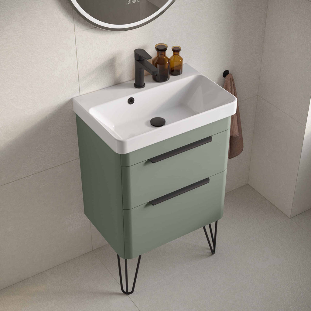 Stylish modern bathroom vanity with sink, black faucet, and storage drawers, featuring a compact design and contemporary aesthetic for a sleek bathroom look.