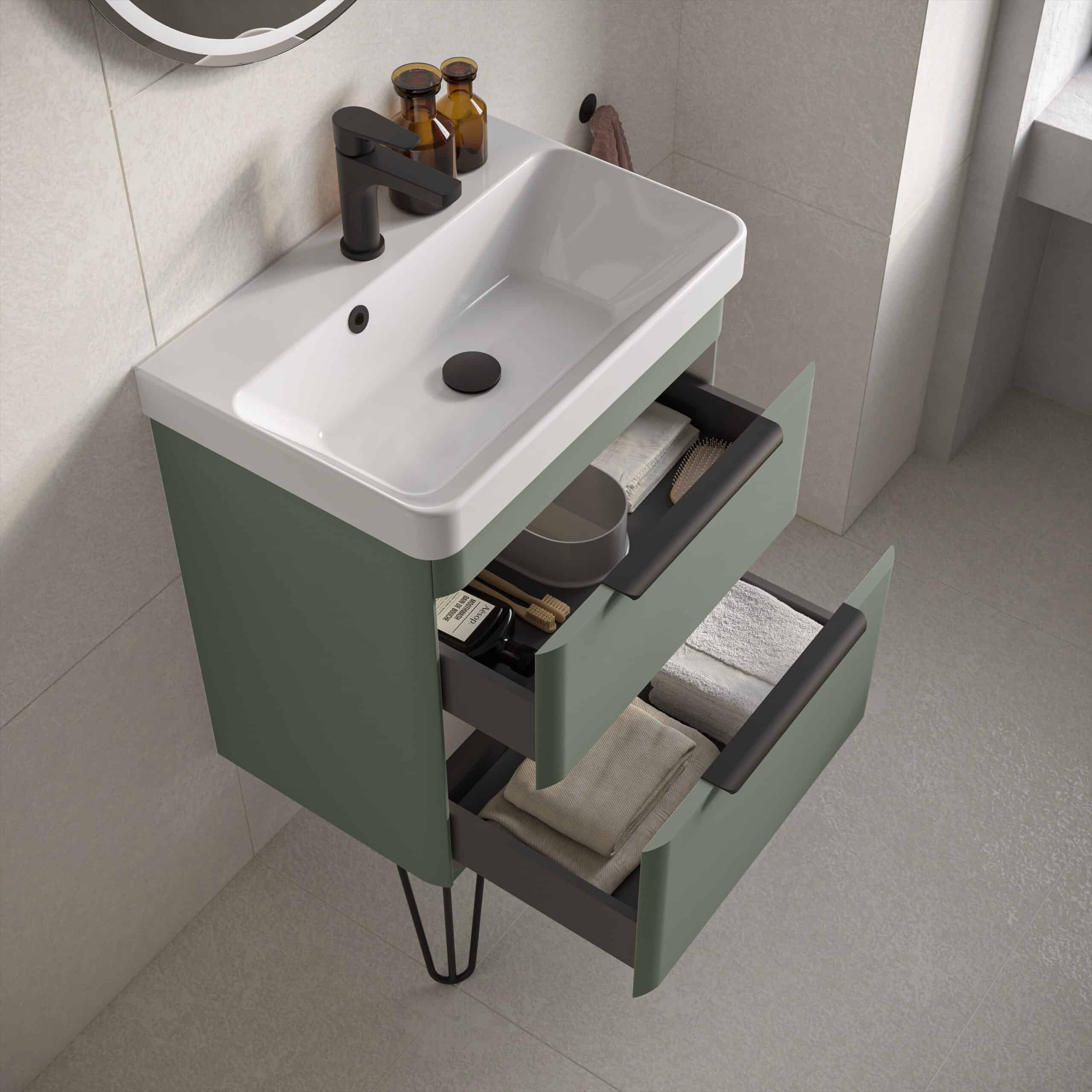 Modern bathroom vanity unit with a white ceramic sink and open drawers filled with towels and toiletries, perfect for contemporary bathroom storage solutions.