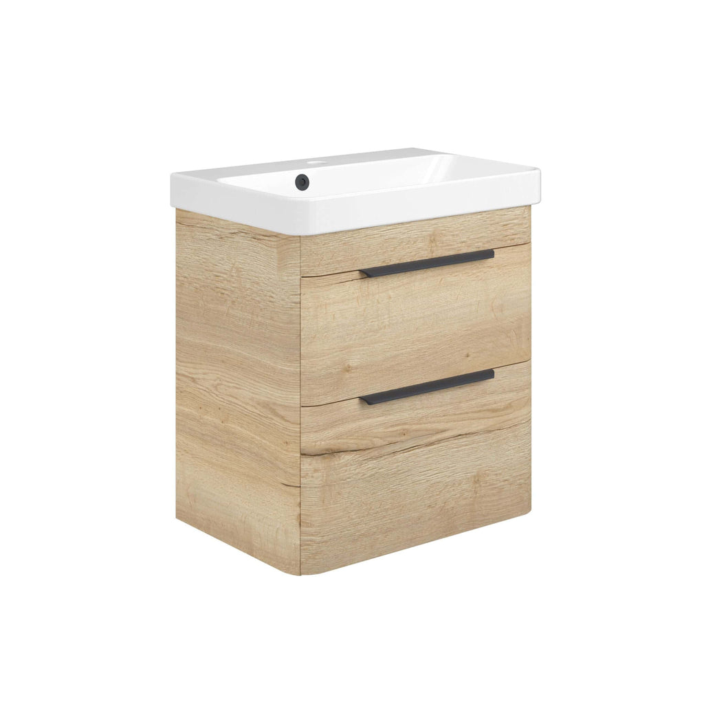Modern wooden bathroom vanity with integrated sink, featuring natural oak finish and sleek black handles, ideal for contemporary bathroom decor.