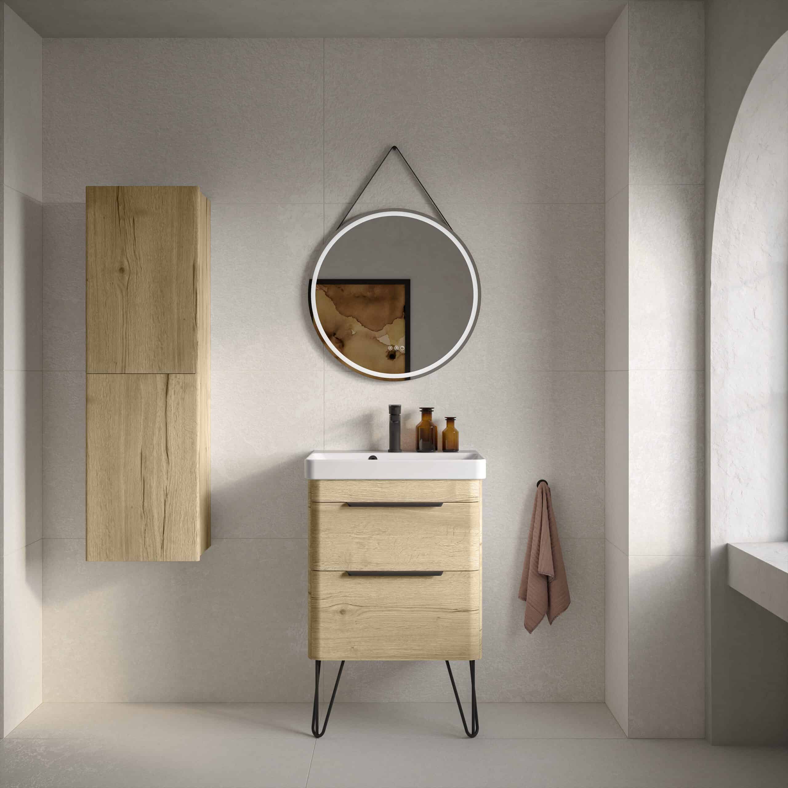 Contemporary bathroom with wooden vanity unit and matching wall cabinet, round mirror with LED lighting, and neutral tones creating a sleek, modern bathroom design.