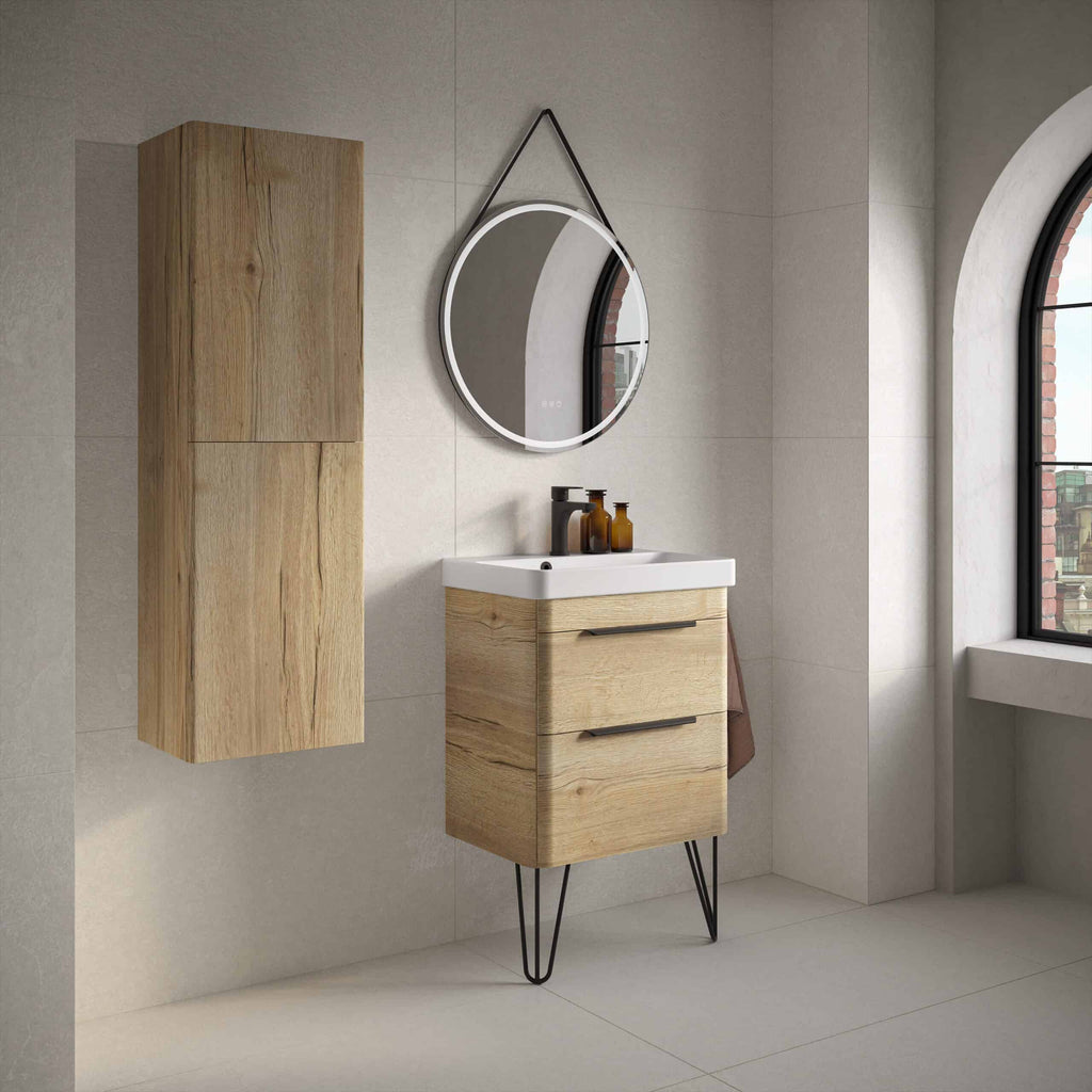 Rustic wooden bathroom vanity with black metal legs, modern round mirror with LED lighting, and matching storage cabinet in a contemporary bathroom setting.