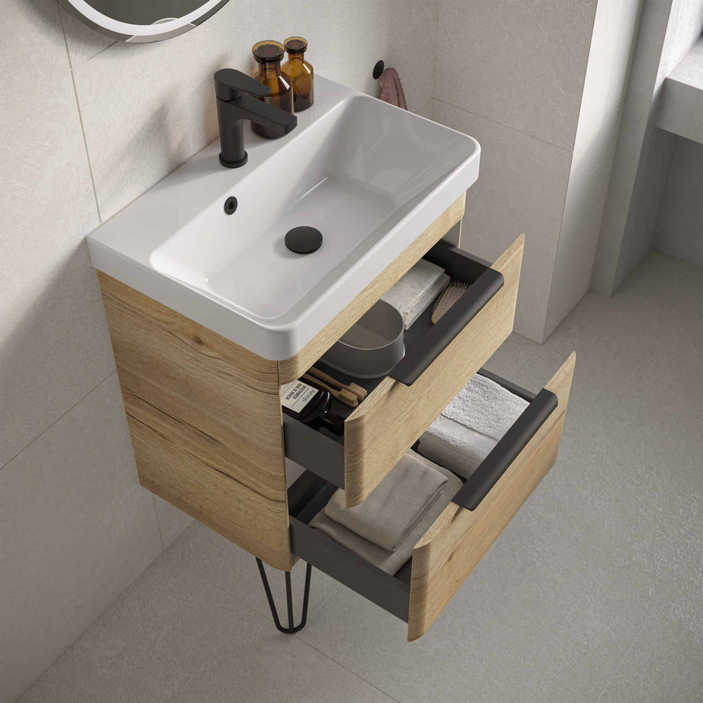 Modern bathroom vanity with white sink, black faucet, and natural wood drawers showcasing stylish bathroom cabinetry and storage solutions.