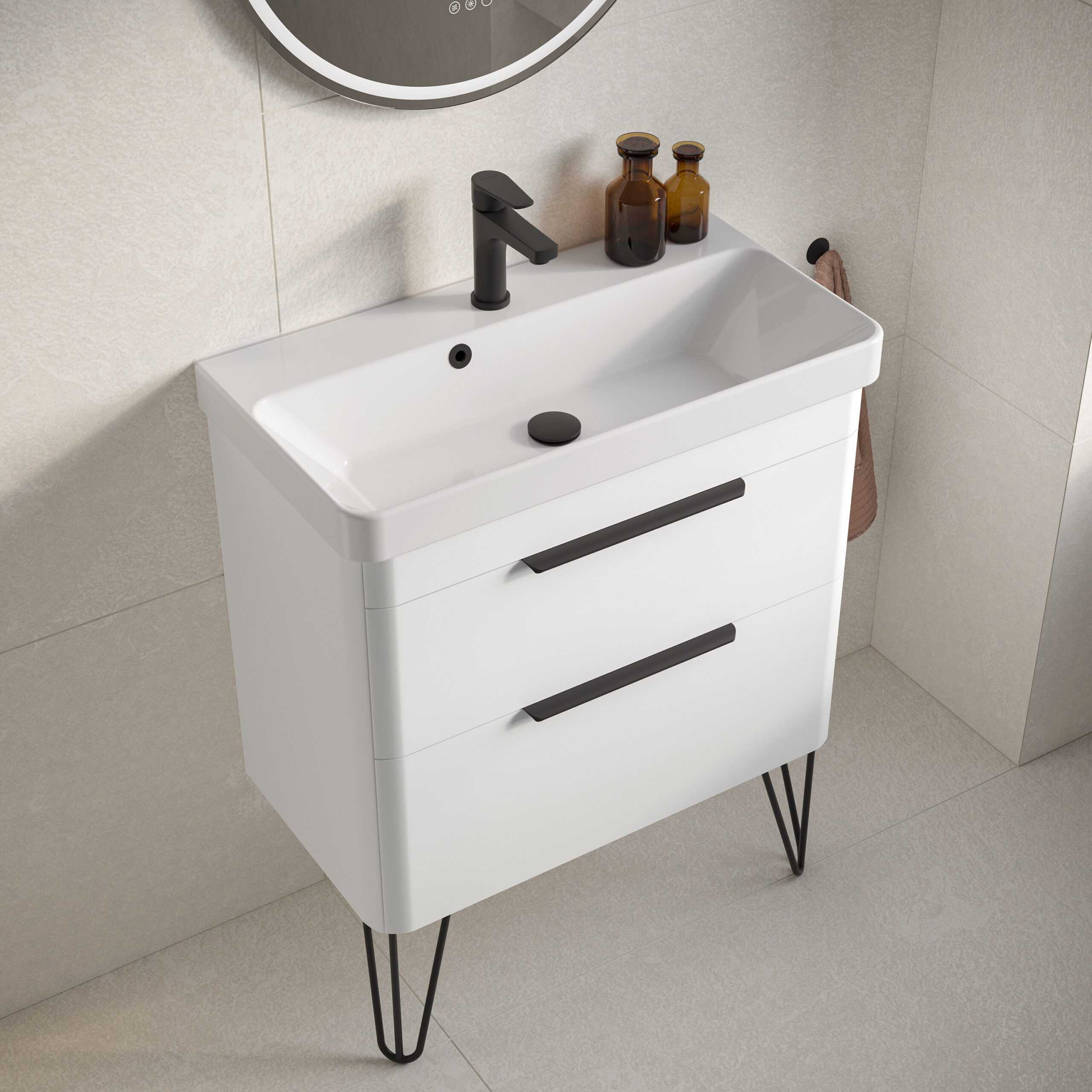 Minimalist white bathroom vanity with black handles and hairpin legs perfect for modern design. Features two spacious drawers, black tap, and accessories for stylish bathroom storage.