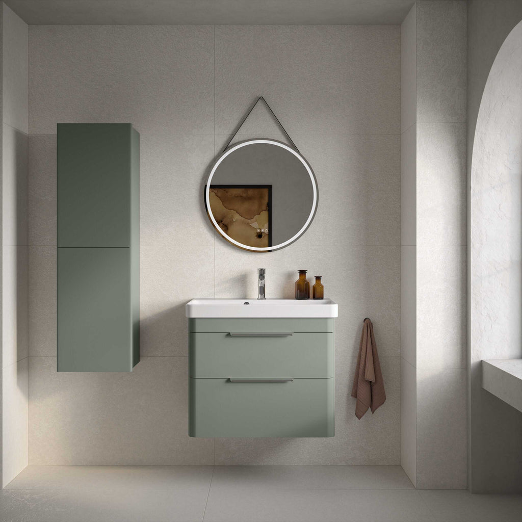 Sleek green bathroom vanity with matching wall cabinet, modern round mirror with LED lighting, and elegant decor elements in a contemporary bathroom setting.