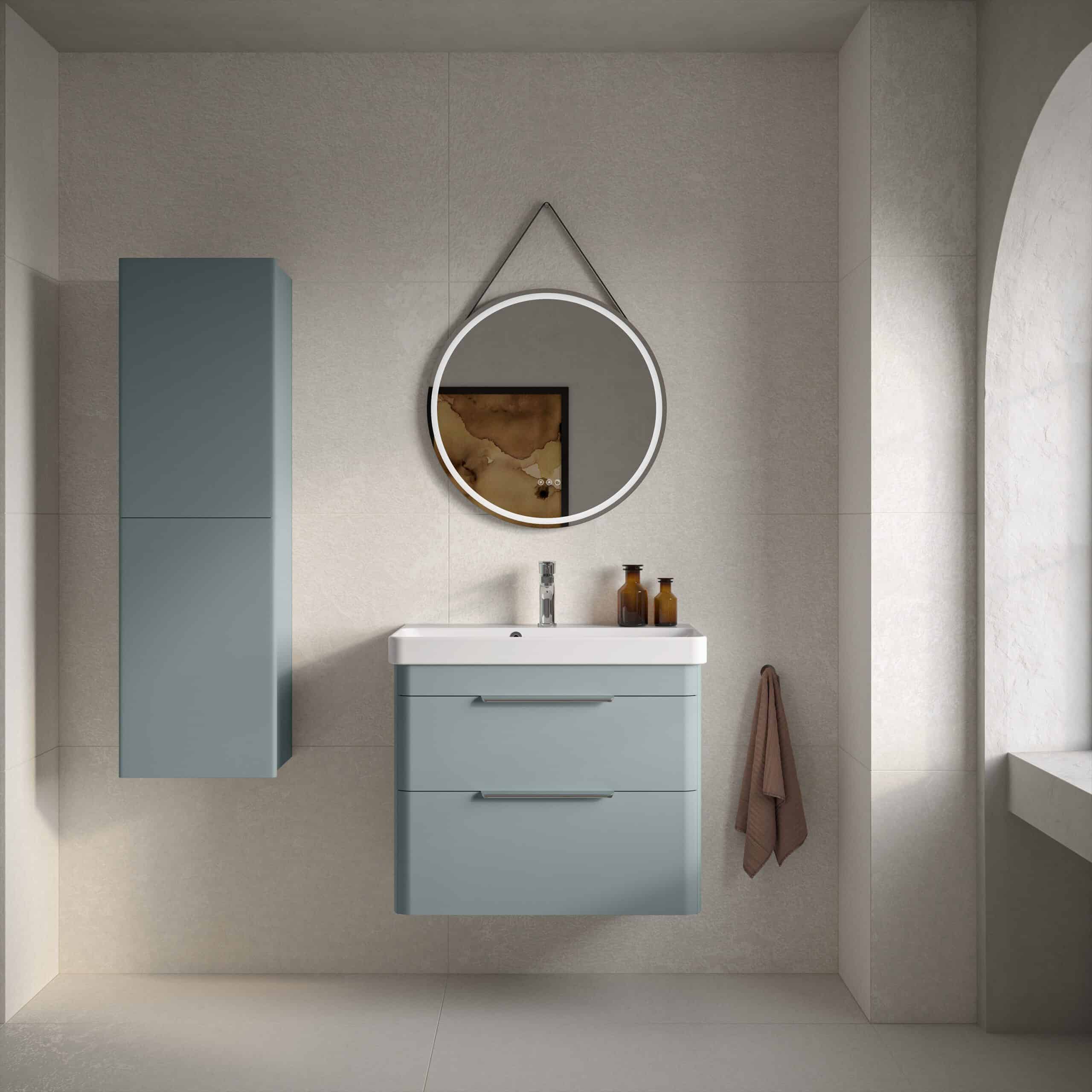Sleek blue bathroom vanity unit with integrated sink and modern mirror in contemporary bathroom interior style.