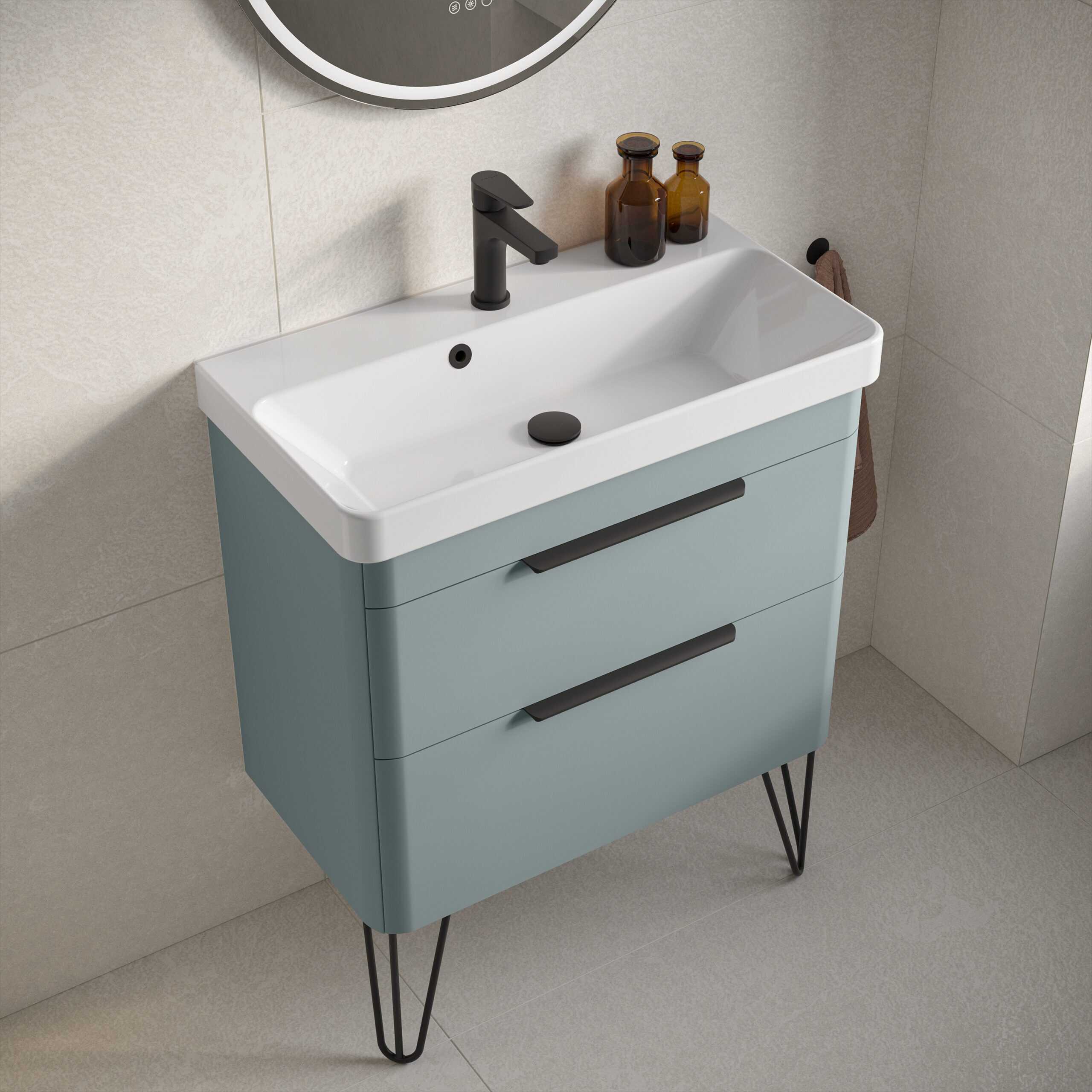 Modern bathroom vanity with integrated sink, black faucet, and storage drawers, featuring sleek, minimalist design in soft blue with black metal hairpin legs.