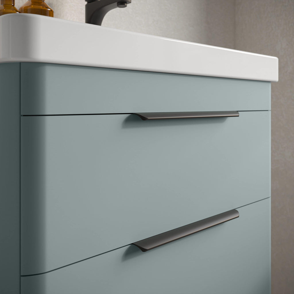 Modern blue bathroom vanity with sleek metal handles and a white ceramic sink, perfect for contemporary bathroom decor and functional bathroom storage.
