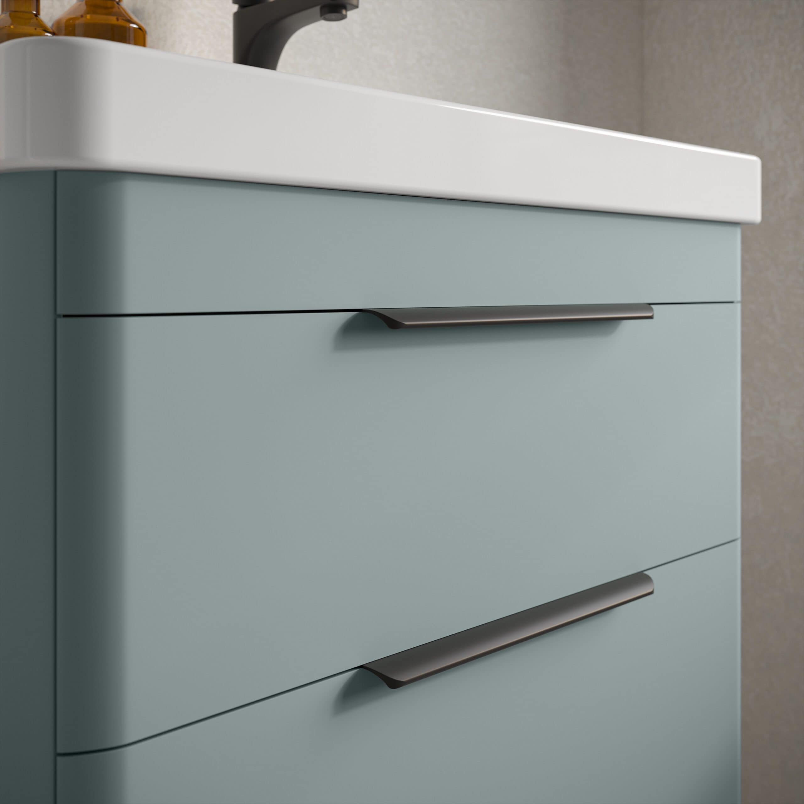 Modern blue bathroom vanity with sleek metal handles and a white ceramic sink, perfect for contemporary bathroom decor and functional bathroom storage.