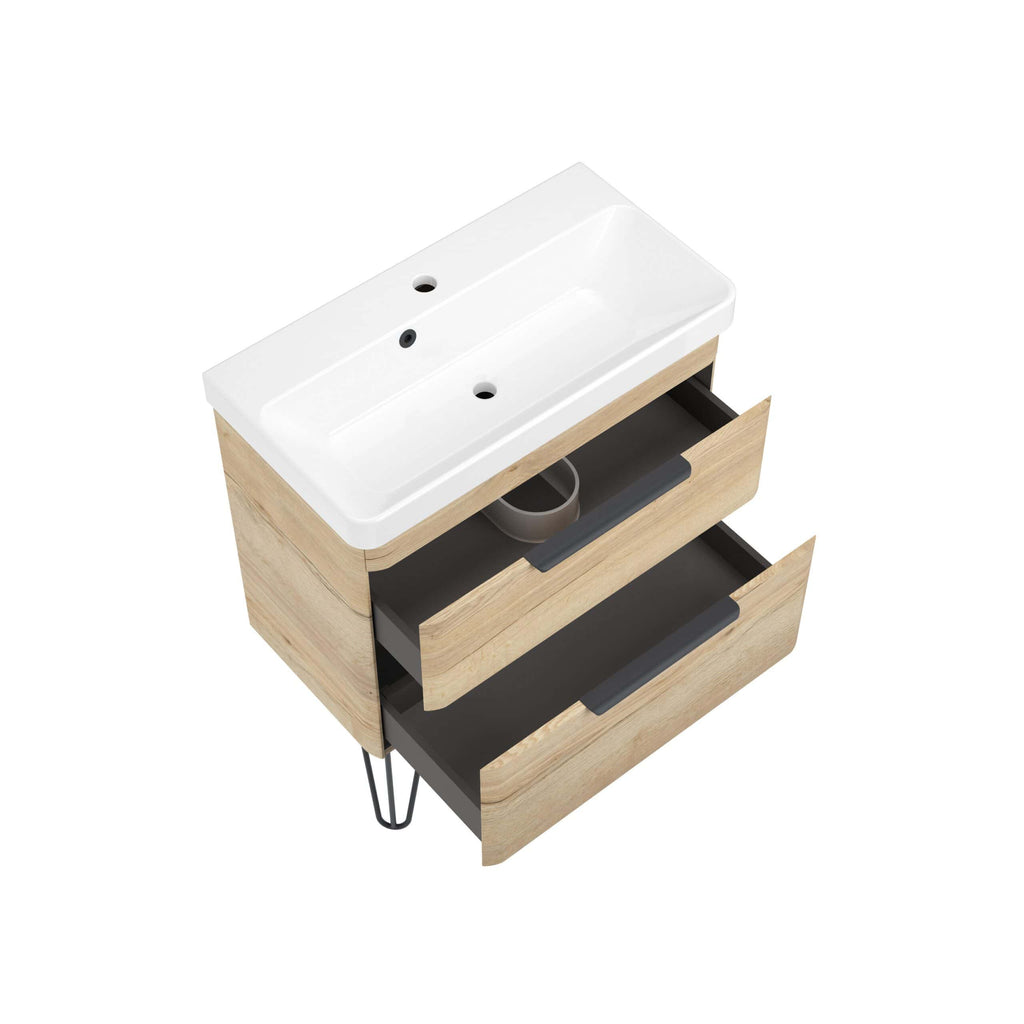 Modern bathroom vanity with integrated sink and natural wood finish, featuring sleek black handles and open storage drawers for stylish organisation.