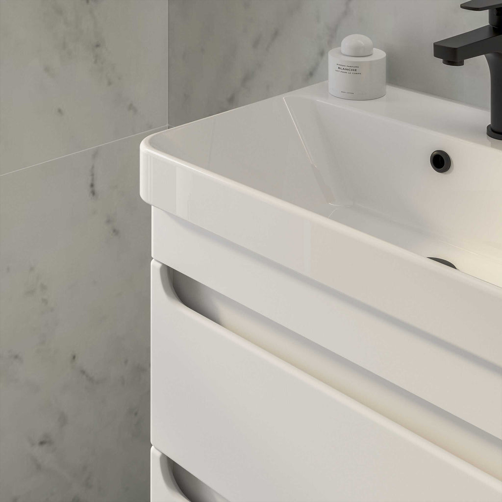 Sleek white bathroom vanity with built-in storage drawers, modern design, and minimalist style, featuring a white ceramic sink and black faucet, ideal for contemporary bathroom decor.