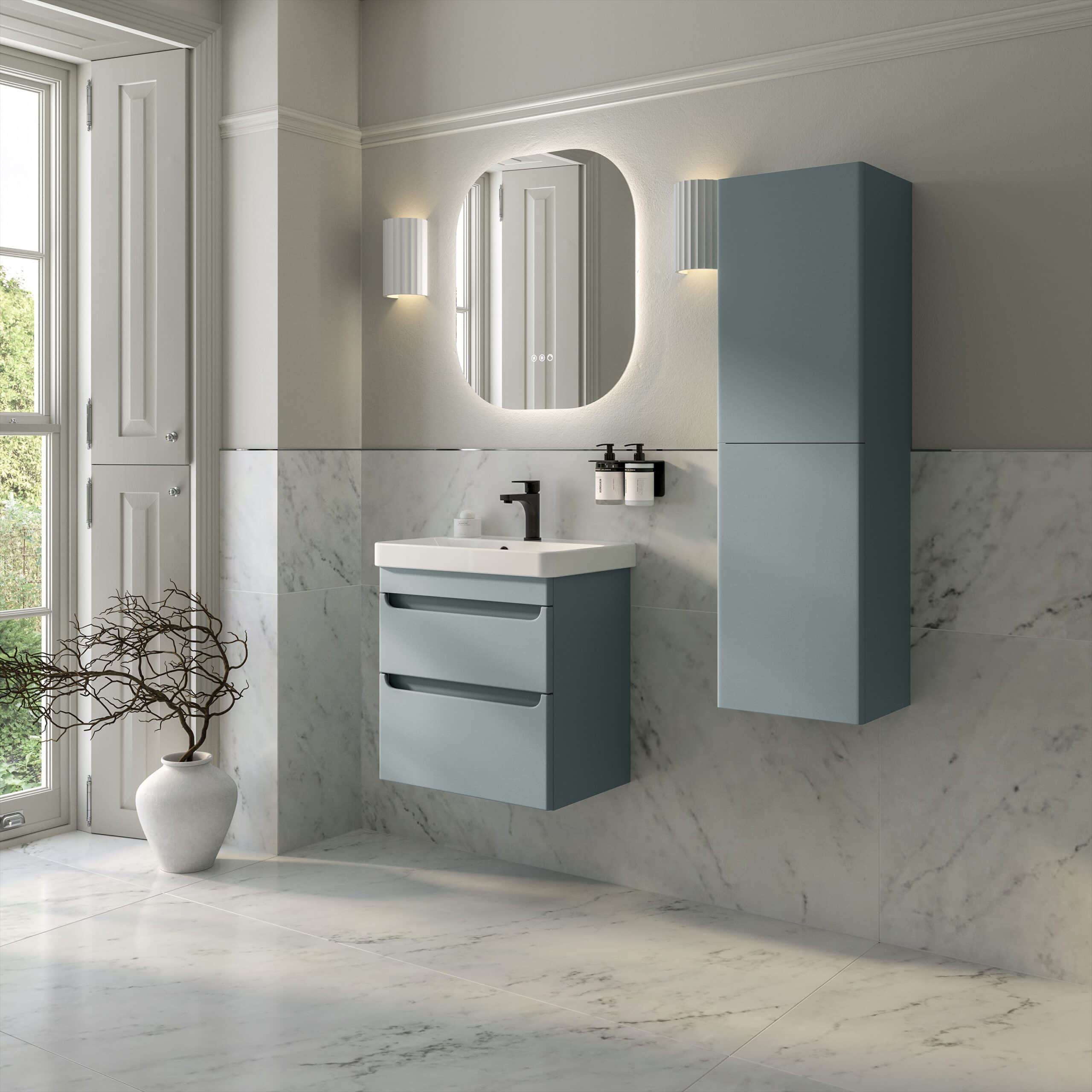 Contemporary blue bathroom vanity with integrated sink and drawers, wall-mounted cabinet, modern black fixtures, located in a stylish marble-finished bathroom with space-saving design.
