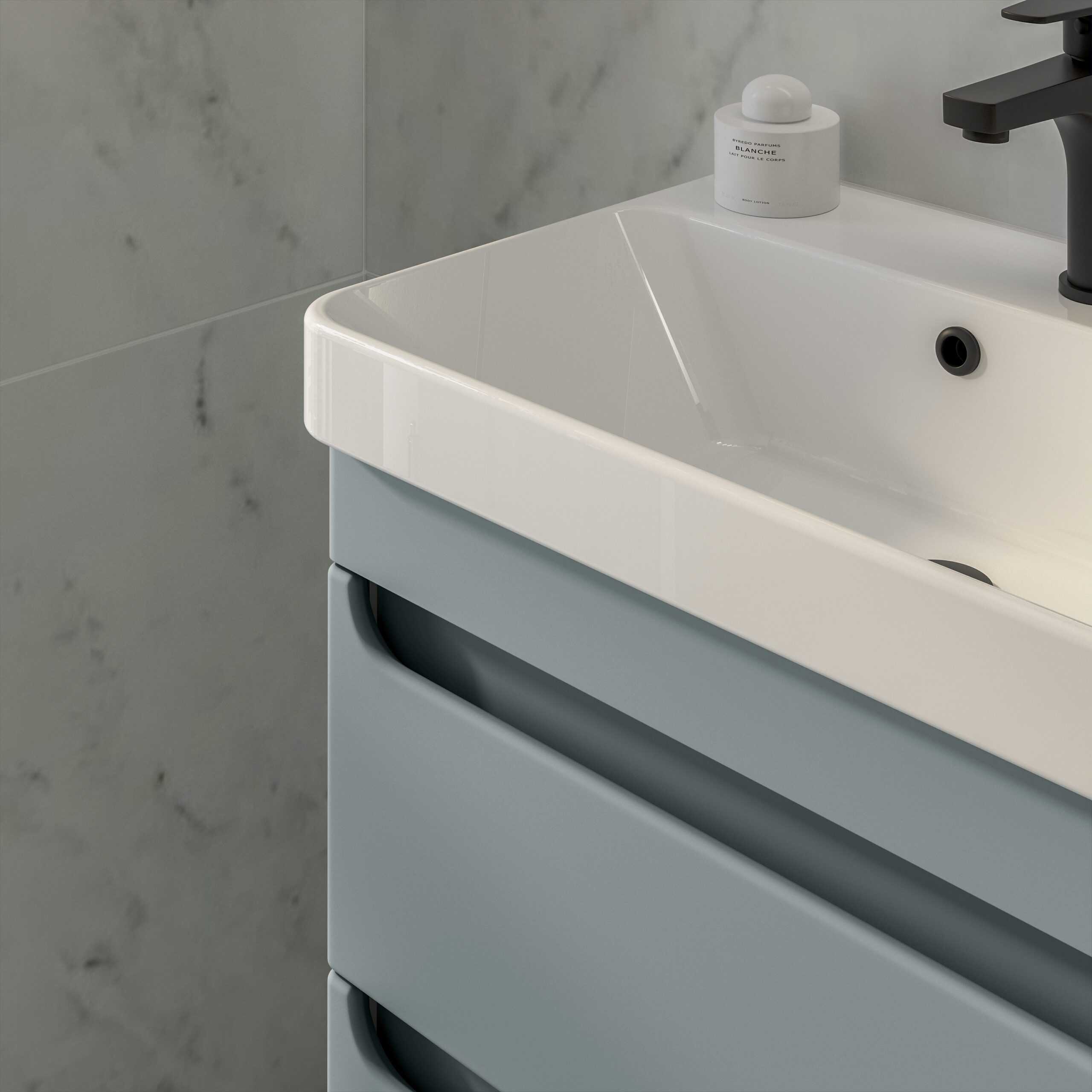 Sleek modern basin with grey vanity cabinet and black tap, minimalist bathroom sink design for contemporary bathrooms.