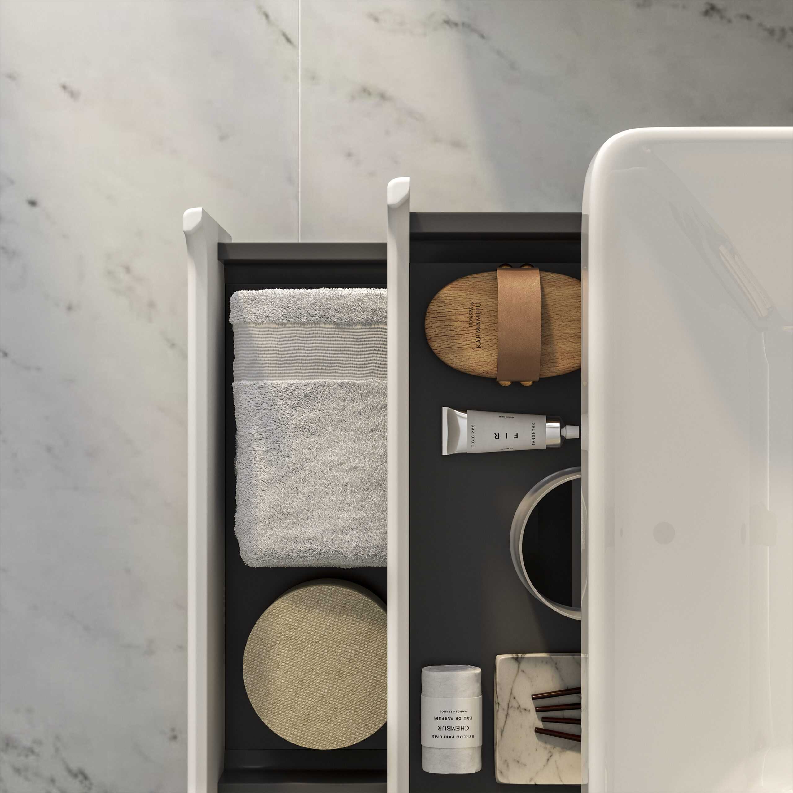 Luxurious bathroom drawer with neatly arranged towels, skincare products, and elegant accessories showcasing high-end bathroom storage and organisation from Bubly Bathrooms.