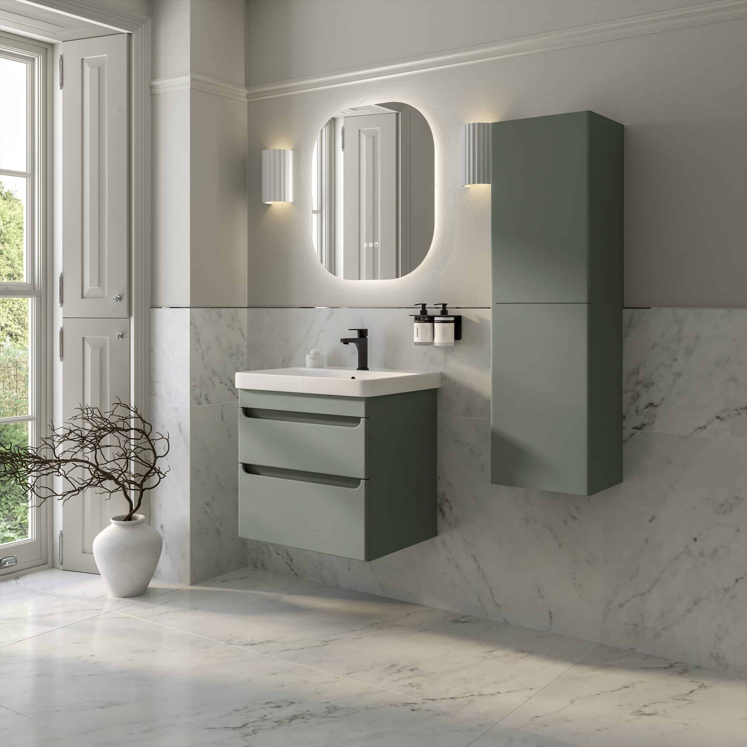Modern green bathroom vanity with wall-mounted cabinet and oval mirror, set against marble walls and flooring, creating a stylish and functional space for contemporary bathrooms.