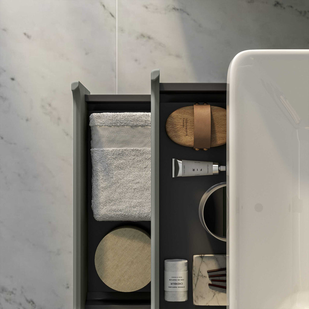 Fresh towels, luxury toiletries, and elegant bathroom accessories organised in a modern bathroom drawer, highlighting premium bathroom essentials for a stylish and functional space.