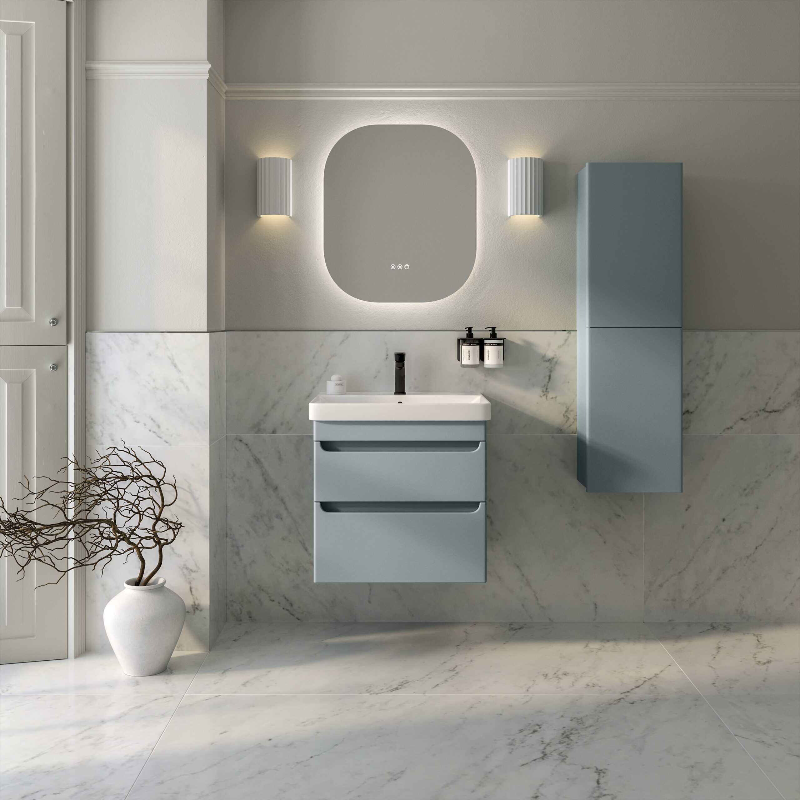Sleek modern bathroom with minimalist design featuring a blue vanity unit, an oval mirror with backlit LED lighting, marble wall and floor accents, and contemporary accessories for a stylish Bubly Bathrooms look.