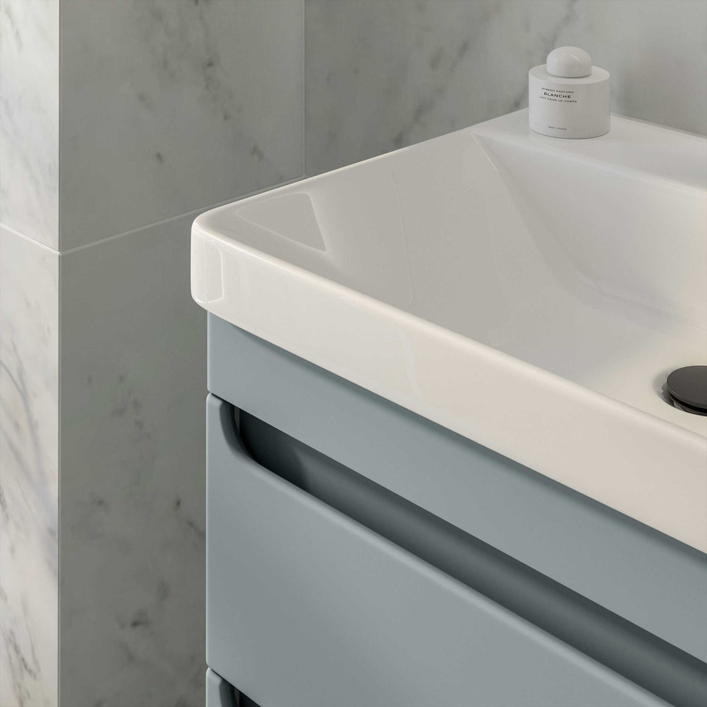 Sleek white bathroom vanity with integrated basin and grey cabinetry, modern design, premium quality fixtures for contemporary bathroom decor.